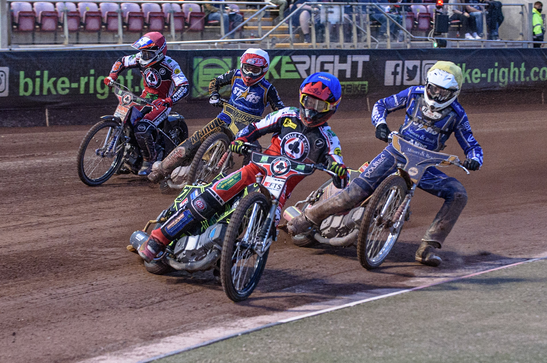 MANCHESTER, UK. AUGUST 23RD    Jye Etheridge  (Blue) leads Kasper Andersen  (Yellow) Ben Barker  (White) and Steve Worrall  (Red) into the first turn during the SGB Premiership match between Belle Vue Aces and King's Lynn Stars at the National Speedway Stadium, Manchester on Monday 23rd August 2021. (Credit: Ian Charles | MI News)