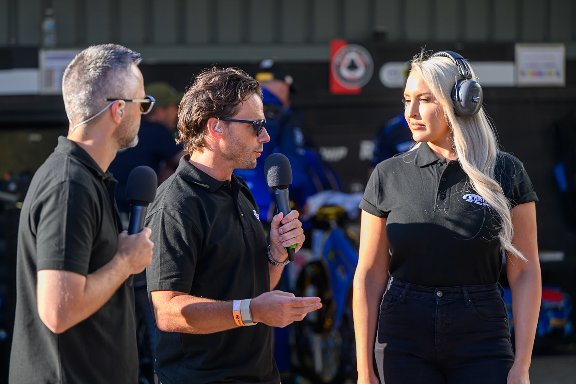 The ITV Presenters for the Live Broadcast (L to R) Rory Schlein, Ollie Allen and Emma Louise Jone during the Cab Direct British Speedway Championship Final at the National Speedway Stadium, Manchester on Saturday 15th August 2026. (Photo: Ian Charles | MI News)