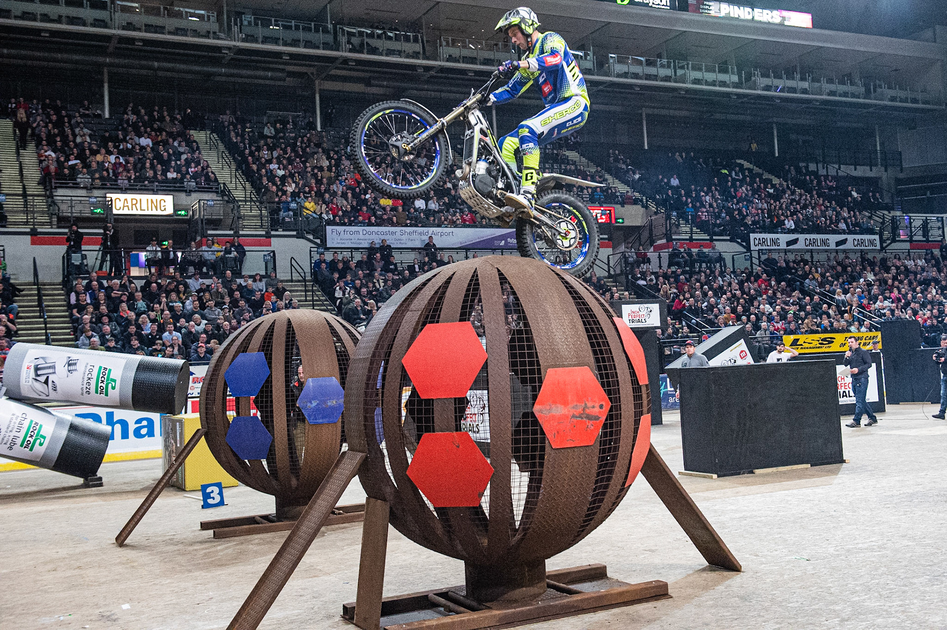 SHEFFIELD, ENGLAND  - DECEMBER 28TH  Dan Peace, UK (Sherco) (right) goes over the globes during the 25th Anniversary Sheffield Indoor Trial at the FlyDSA Arena, Sheffield on Saturday 28th December 2019. (Credit: Ian Charles | MI News)