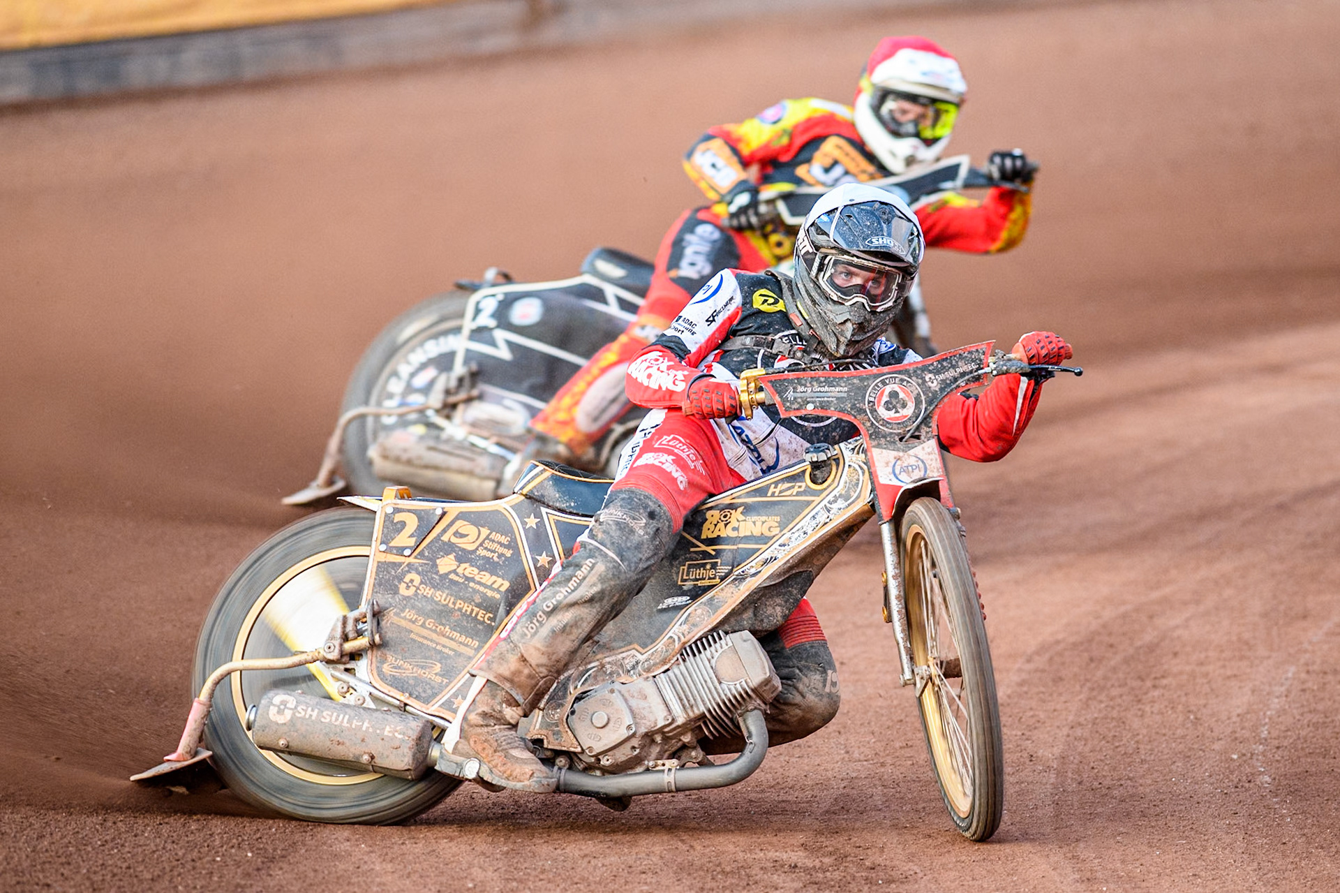 Belle Vue Aces' Norick Blodorn in White leading Leicester Lions' Richard Lawson in Red during the Rowe Motor Oil Premiership match between Leicester Lions and Belle Vue Aces at the Pidcock Motorcycles Arena, Leicester on Thursday 25th July 2024. (Photo: Ian Charles | MI News)