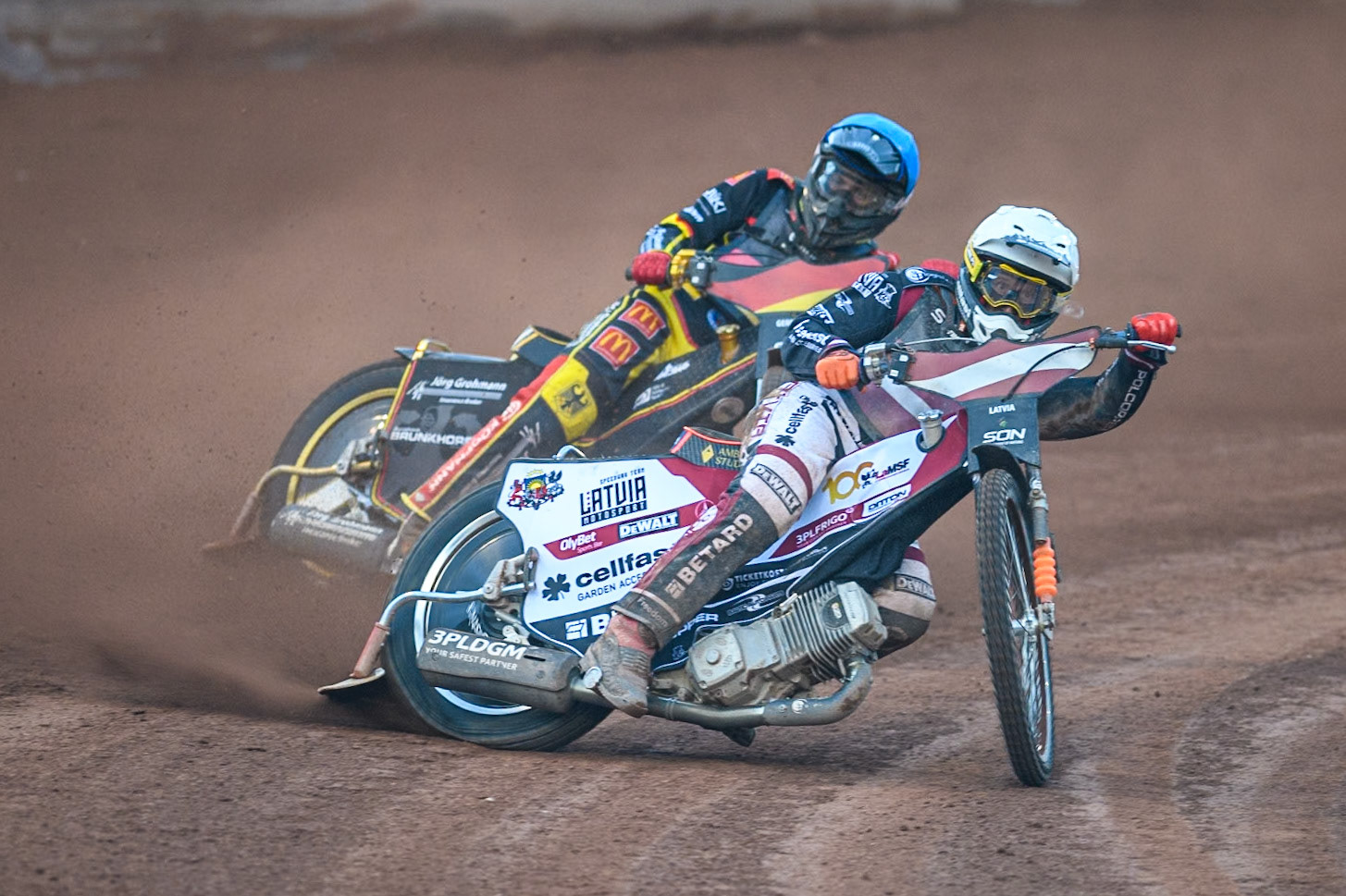 GERMANY v LATVIA: Andzejs Lebedevs of Latvia in White leading Norick Blödorn of Germany in Blue during the Monster Energy FIM Speedway of Nation Final at the National Speedway Stadium, Manchester on Saturday 13th July 2024. (Photo: Ian Charles | MI News)