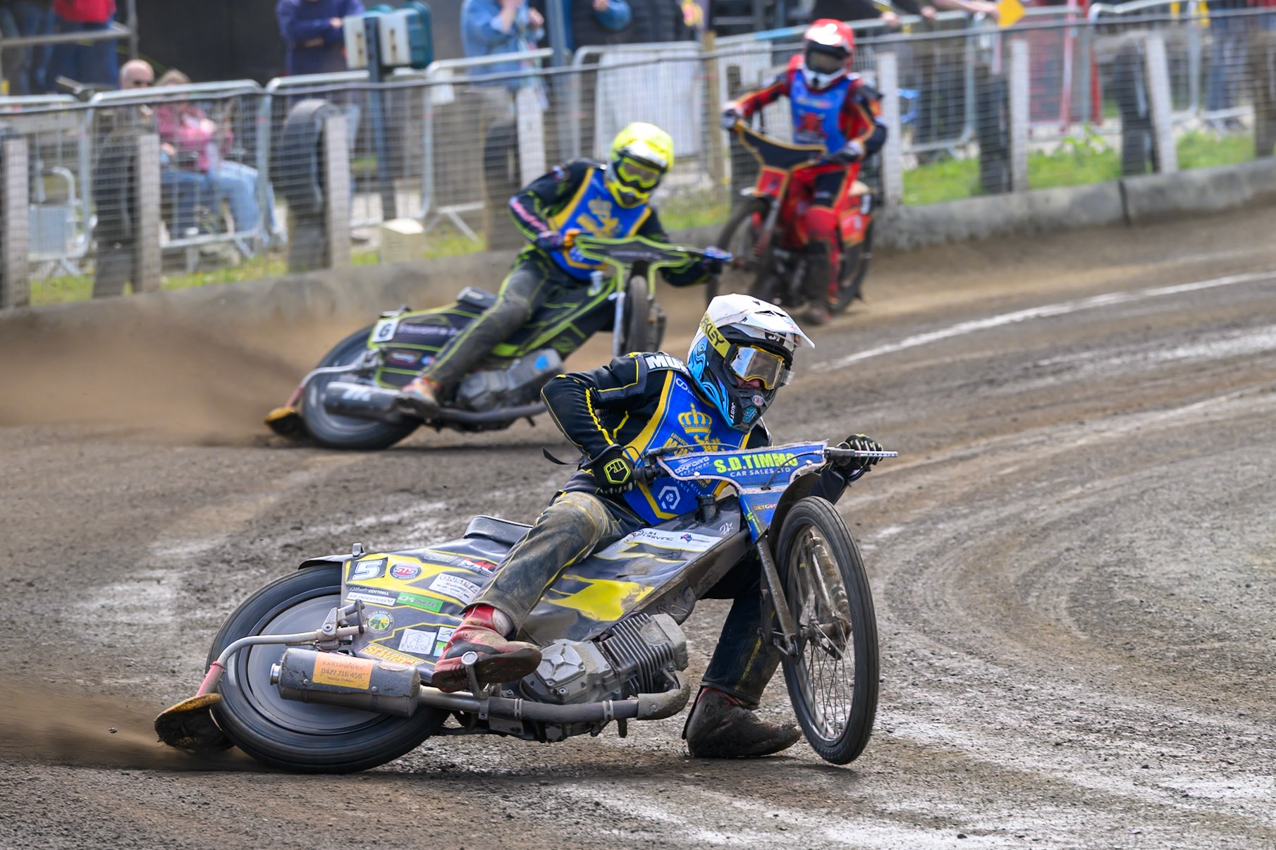 Dayle Wood of Edinburgh Monarchs Academy in White leading Ben Whalley of Edinburgh Monarchs Academy in Yellow and Luke Harris of Buxton Bulls in Red during the WSRA National Development League match between Buxton Bulls and Edinburgh Monarchs Academy at Hi-Edge Speedway, Buxton on Sunday 14th June 2026. (Photo: Ian Charles | MI News)