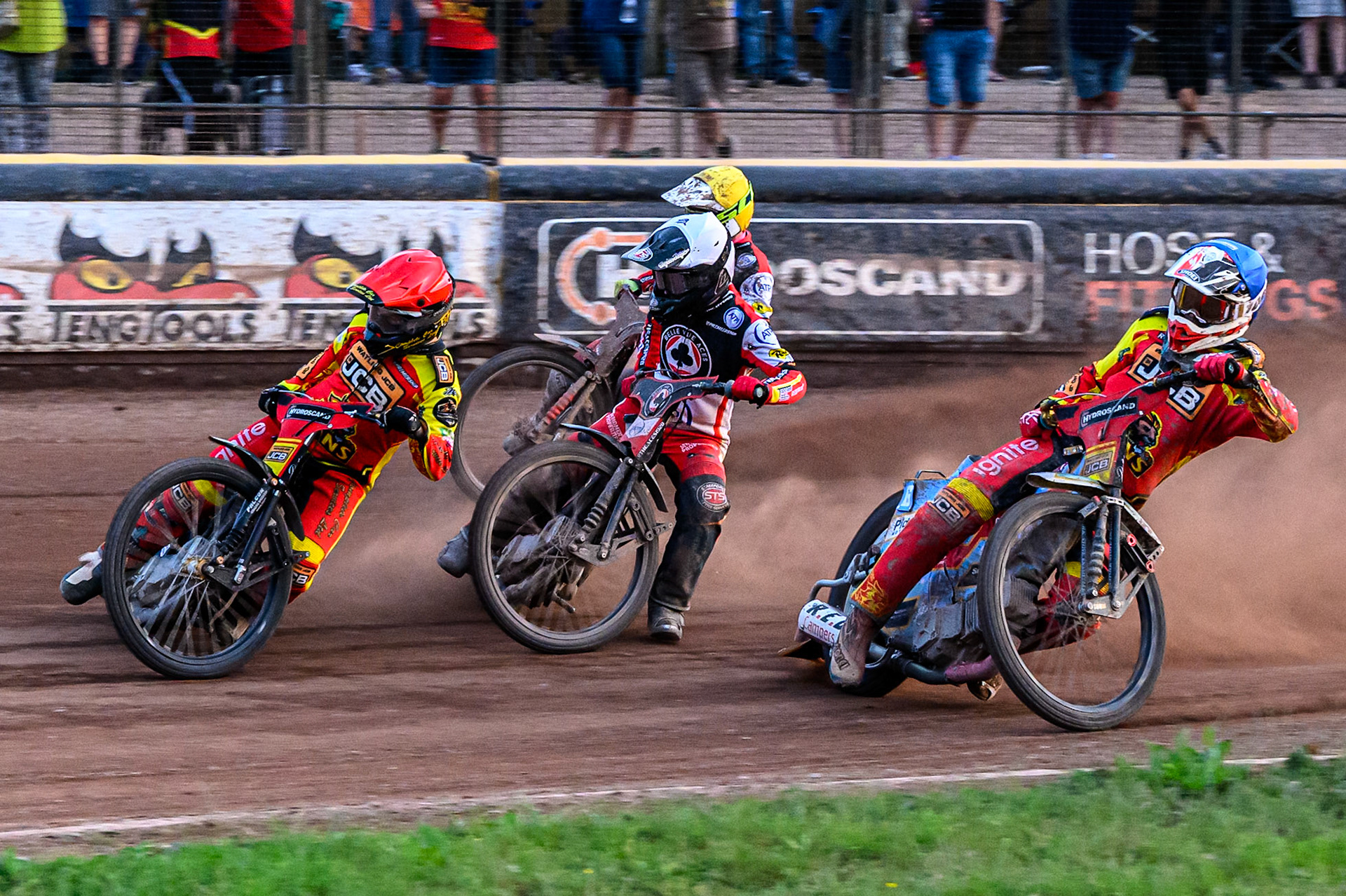 Leicester Lions' Kyle Howarth in Red leading Belle Vue Aces' Zach Cook in White, Belle Vue Aces' Jake Mulford in Yellow and Leicester Lions' Drew Kemp in Blue during the Rowe Motor Oil Premiership match between Leicester Lions and Belle Vue Aces at the Hydroscand Arena, Leicester on Thursday 19th June 2025. (Photo: Ian Charles | MI News)