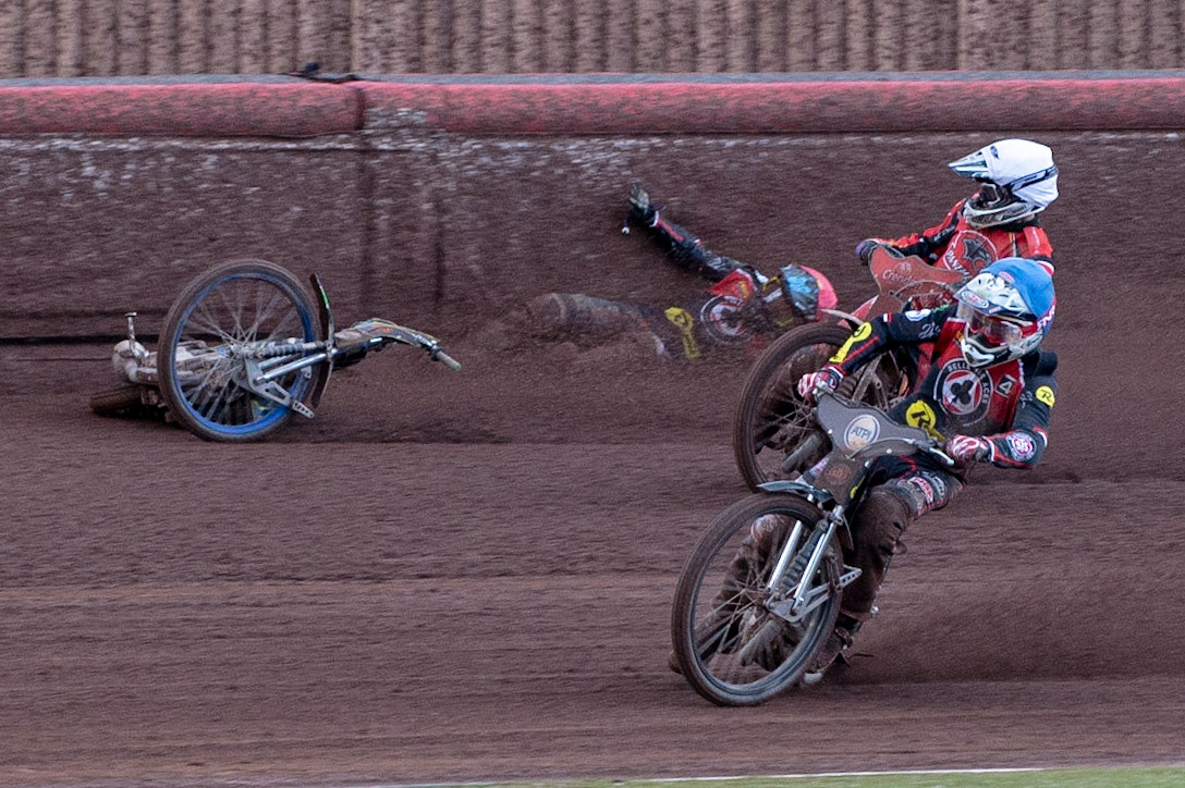 Photo by Ian Charles:

Dan Bewley  (Red) falls after clashing with Rohan Tungate (White) with Steve Worrall  leading

Belle Vue Aces v Peterborough Panthers, British Speedway Premiership, National Speedway Stadium, Manchester, Thursday, 13, June, 2019