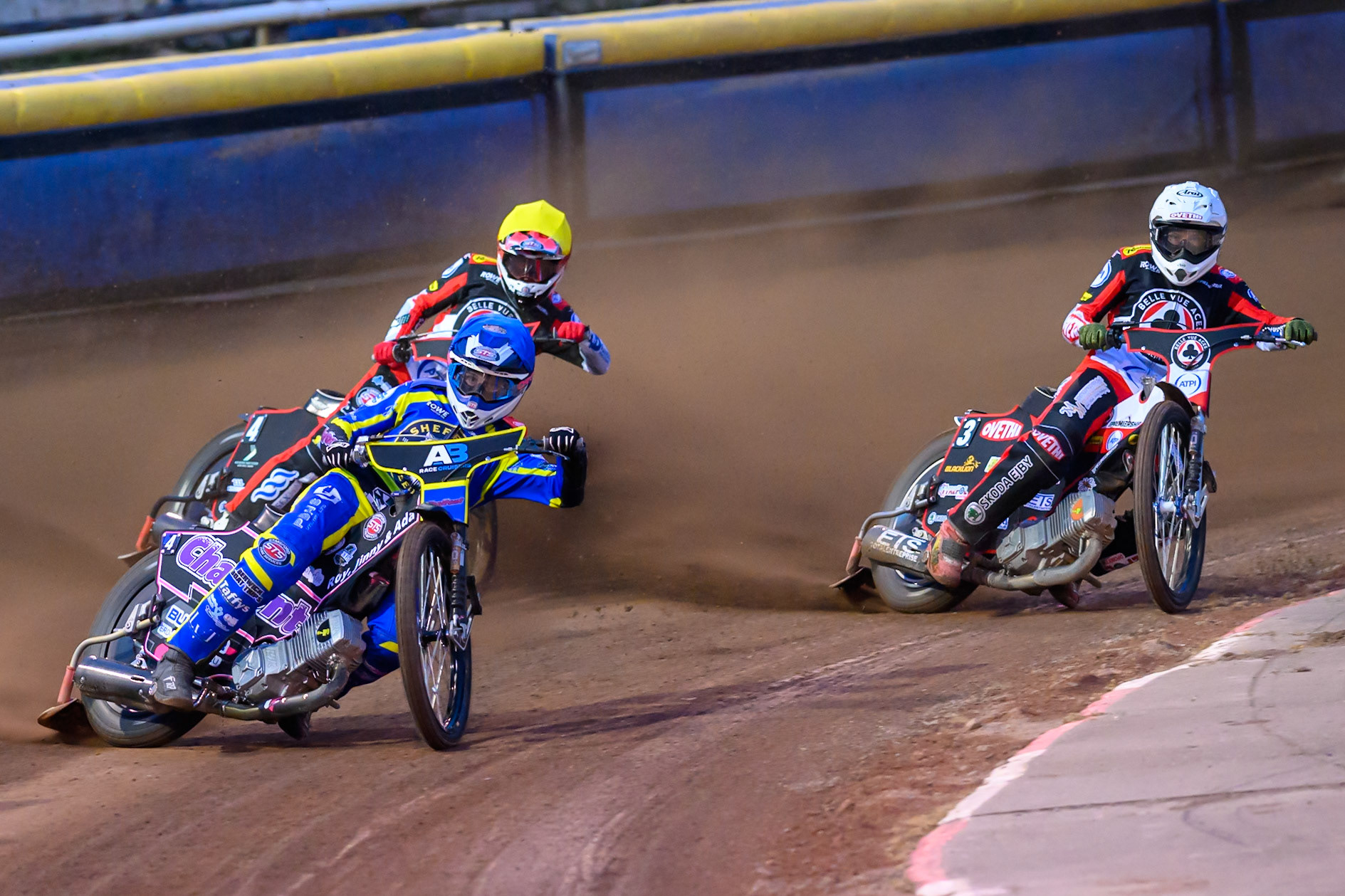 Leon Flint of Sheffield Tigers  in Blue leading Peter Kildemand of Belle Vue Aces in White and Zach Cook of Belle Vue Aces in Yellow during the Knockout Cup Northern Section match between Sheffield Tigers and Belle Vue Aces at Owlerton Stadium, Sheffield on Thursday 2nd April 2026. (Photo: Ian Charles | MI News)