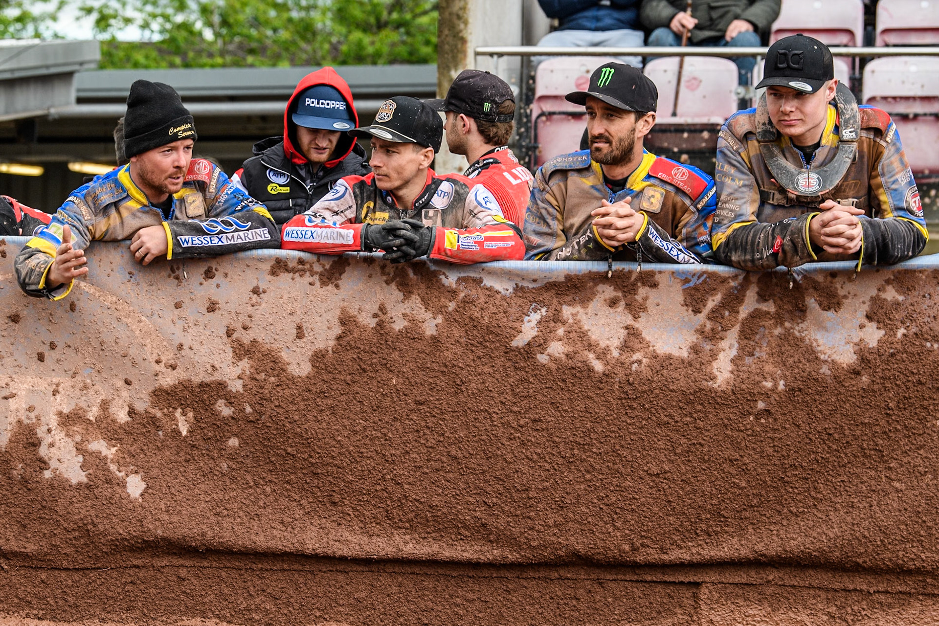 Riders discuss the state of the track (L to R): Sheffield Tigers' Kyle Howarth Belle Vue Aces' Ben Cook, Chris Holder and Sheffield Tigers' Dan Gilkes during the Rowe Motor Oil Premiership match between Belle Vue Aces and Sheffield Tigers at the National Speedway Stadium, Manchester on Monday 27th May 2024. (Photo: Ian Charles | MI News)