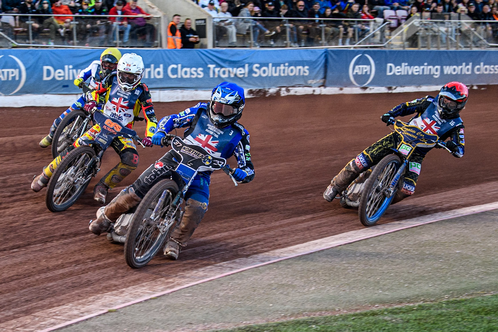 Chris Harris in Blue leading Steve Worrall in White Craig Cook in Yellow and Kyle Howarth in Red during the Attis Insurance Sports Division British Speedway Championship Final at the National Speedway Stadium, Manchester on Saturday 8th June 2024. (Photo: Ian Charles | MI News)