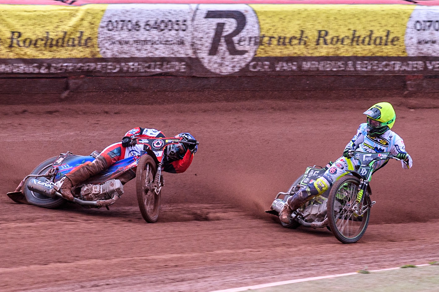 Belle Vue Aces' Ben Cook in Blue loses control after a tangle with Oxford Spires' Charles Wright in Yellow during the Rowe Motor Oil Premiership match between Belle Vue Aces and Oxford Spires at the National Speedway Stadium, Manchester on Monday 22nd July 2024. (Photo: Ian Charles | MI News)