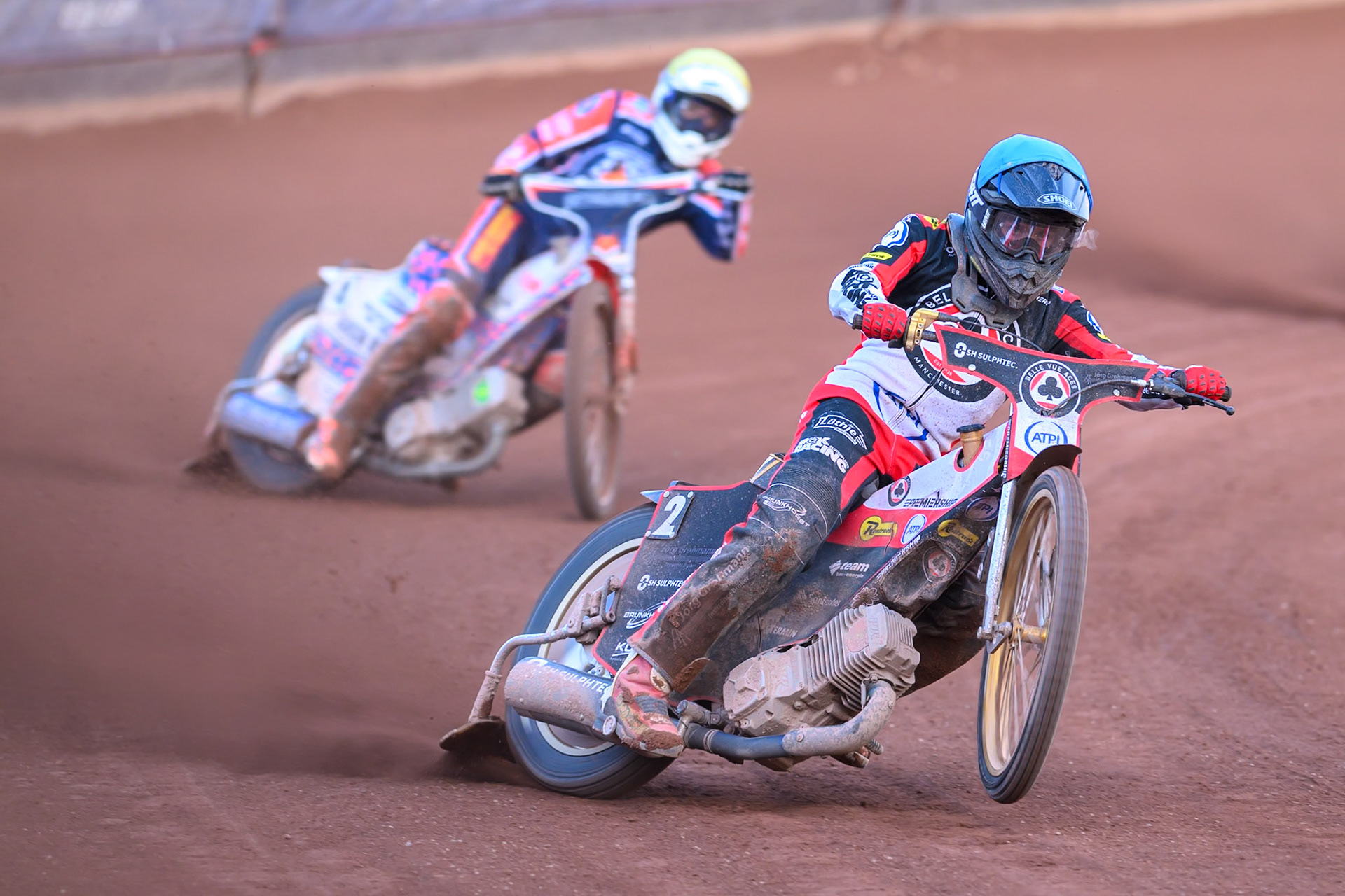 Norick Blodorn of Belle Vue Aces in Blue leading Niels-Kristian Iversen of Northampton Foxes in Yellow during the Rowe Motor Oil Premiership match between Belle Vue Aces and Northampton Foxes at the National Speedway Stadium, Manchester on Monday 13th July 2026. (Photo: Ian Charles | MI News)