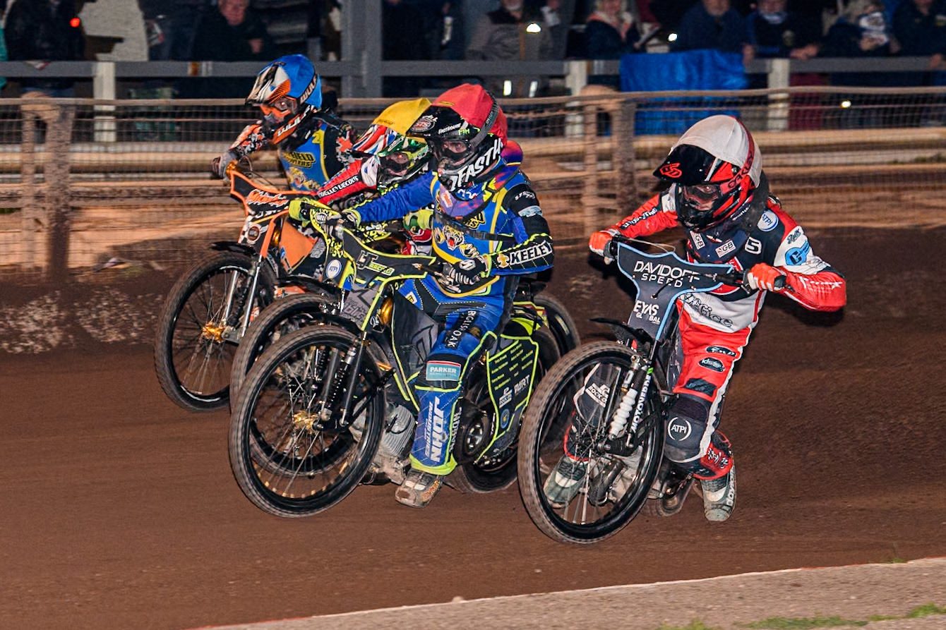Belle Vue Colts' Freddy Hodder  in White rides inside Sheffield Tiger Cubs' Nathan Ablitt  in Red, Belle Vue Colts' William Cairns  in Yellow and Sheffield Tiger Cubs' Mickie Simpson  in Blue during the WSRA National Development League match between Sheffield Tiger Cubs and Belle Vue Colts at Owlerton Stadium, Sheffield on Thursday 12th September 2024. (Photo: Ian Charles | MI News)