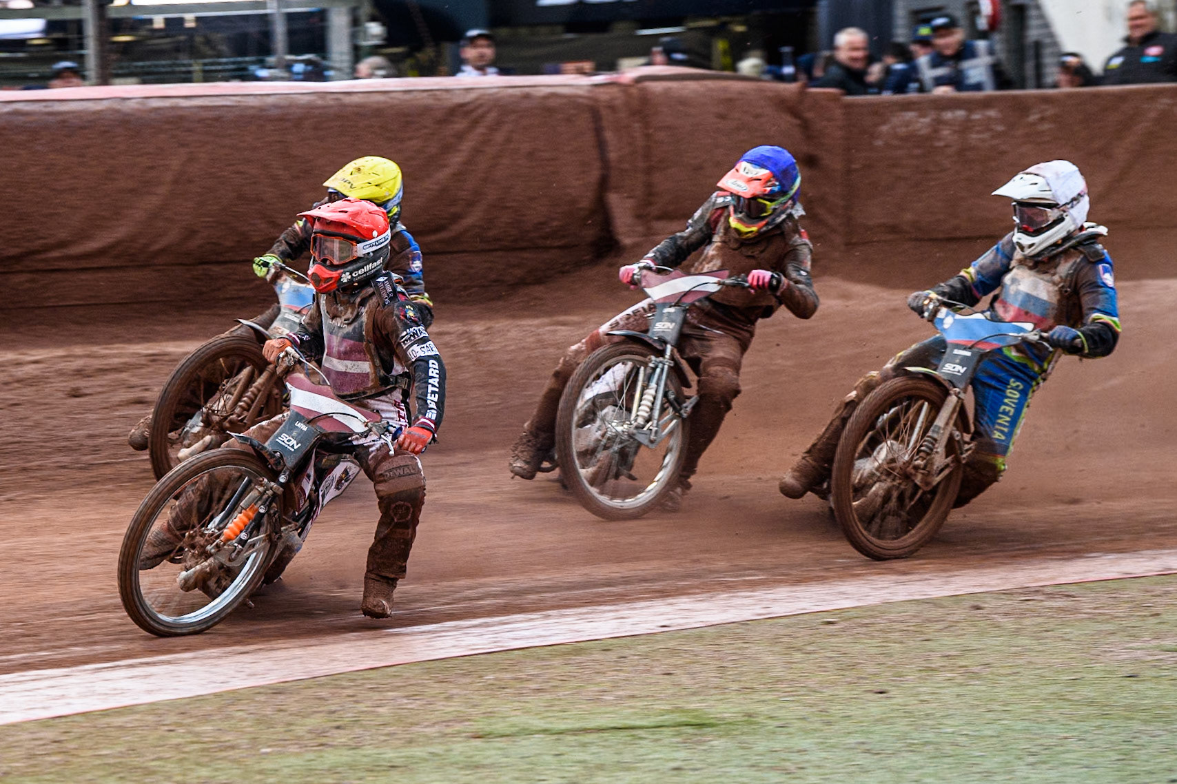 Latvia v Czech Republic: Andzejs Lebedevs of Latvia in Red leading Matic Ivacic of Slovenia in Yellow, Daniils Kolodinskis of Latvia in Blue and Anze Grmek of Slovenia in White during the Monster Energy FIM Speedway of Nation Semi Final 2 at the National Speedway Stadium, Manchester on Wednesday 10th July 2024. (Photo: Ian Charles | MI News)