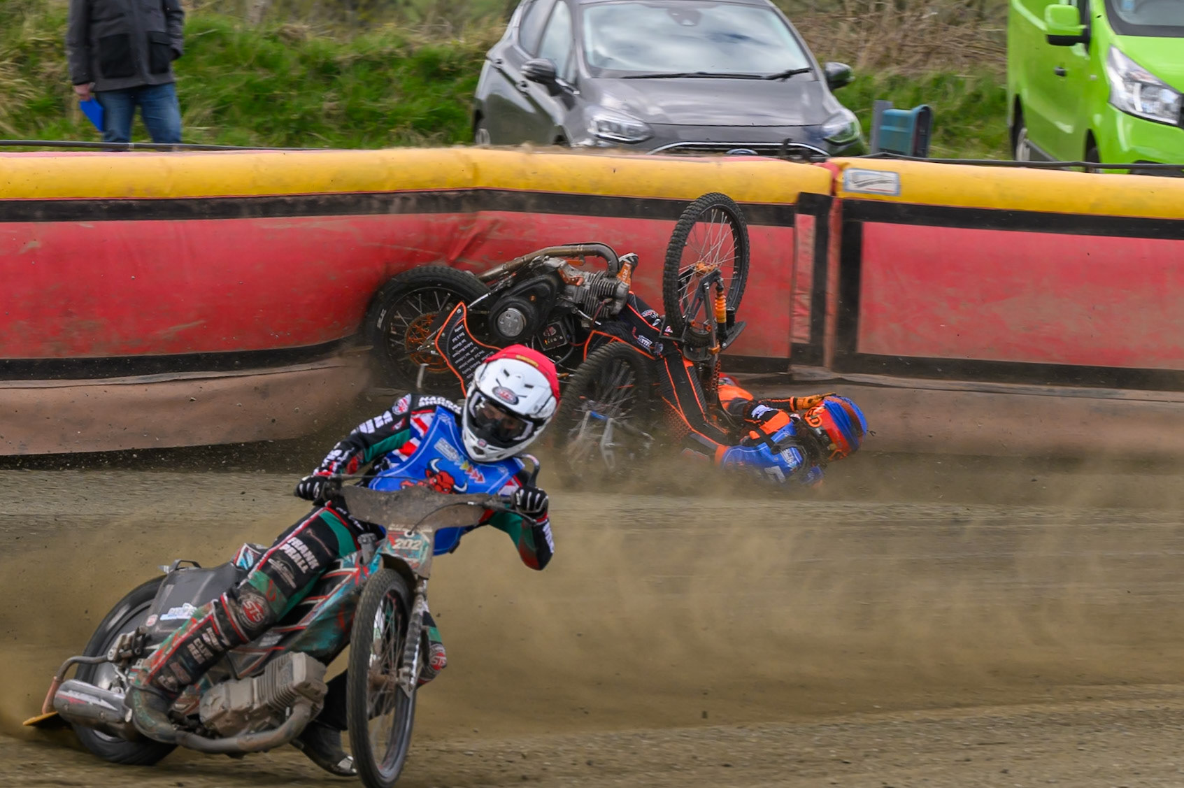 Connor Coles of NDL Nomads   in White fall and Jack Smith of Buxton Bulls   in Blue collides with him during the  Challenge match between Buxton Bulls and NDL Nomads at Hi-Edge Speedway, Buxton on Sunday 19th April 2026. (Photo: Ian Charles | MI News)