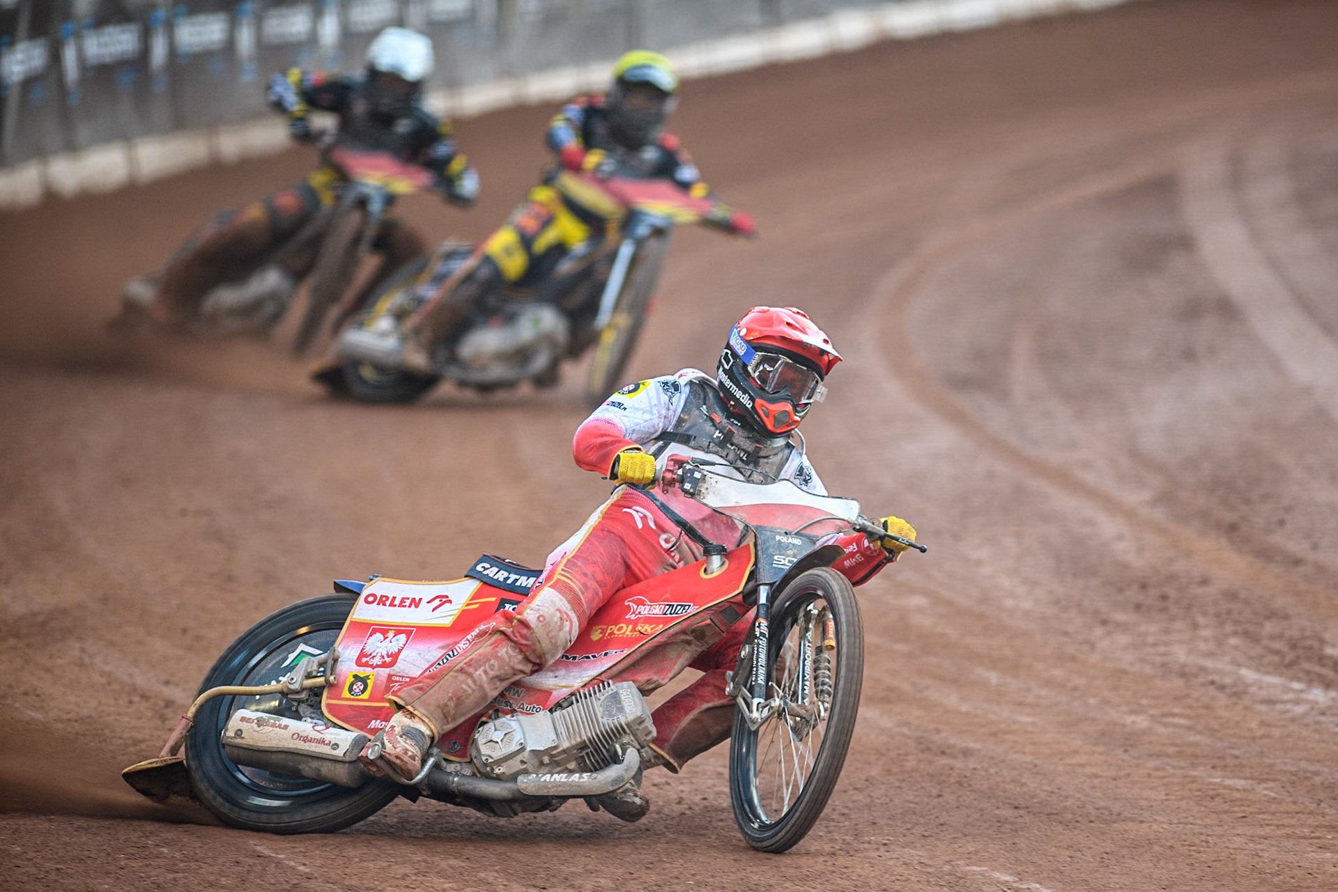 Dominik Kubera of Poland in Red leading Norick Blödorn of Germany in Yellow and Kai Huckenbeck of Germany in White during the Monster Energy FIM Speedway of Nation Final at the National Speedway Stadium, Manchester on Saturday 13th July 2024. (Photo: Ian Charles | MI News)