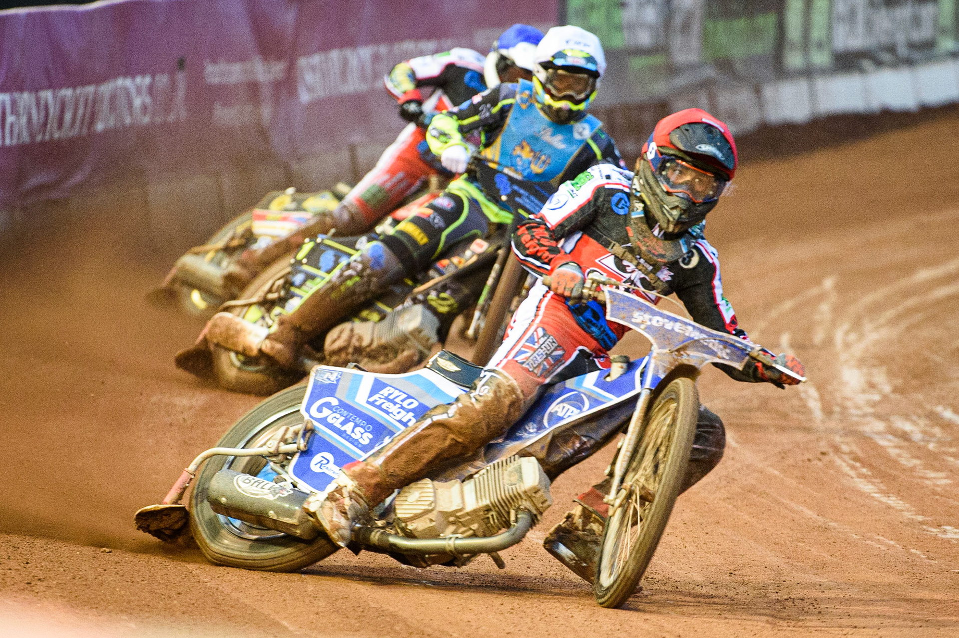 MANCHESTER, UK. AUGUST 20TH Harry McGurk  (Red) and Paul Bowen (Blue) lead Kyle Bickley  (White) during the National Development League match between Belle Vue Aces and Armadale Devils at the National Speedway Stadium, Manchester on Friday 20th August 2021. (Credit: Ian Charles | MI News)