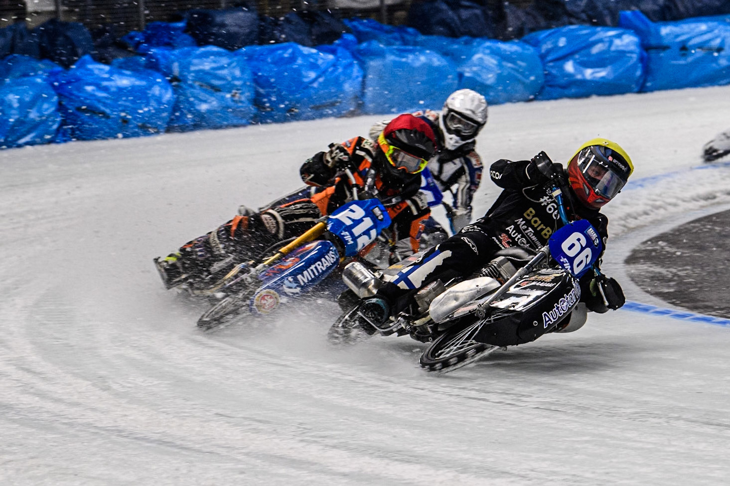 Aki Ala-Riihimäki (66) of Finland in Yellow leading Lukas Hutla (212) of the Czech Republic in Red and Max Koivula (24) of Finland in White during the Ice Speedway Gladiators World Championship Final 2 at Max-Aicher-Arena, Inzell on Sunday 16th March 2025. (Photo: Ian Charles | MI News)