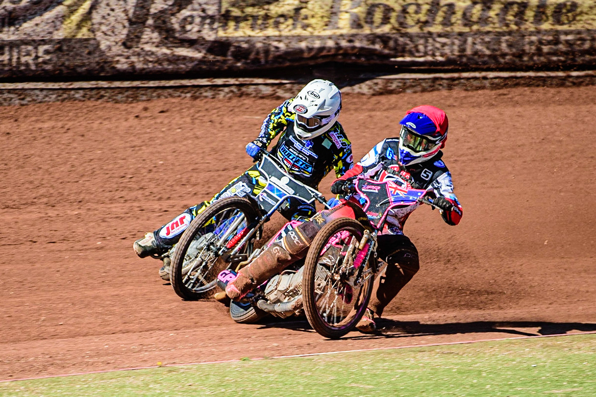 James Pearson   (Red) passes Greg Blair  (White) during the National Development League match between Belle Vue Colts and Berwick Bullets at the National Speedway Stadium, Manchester on Friday 7th April 2023. (Photo: Ian Charles | MI News)