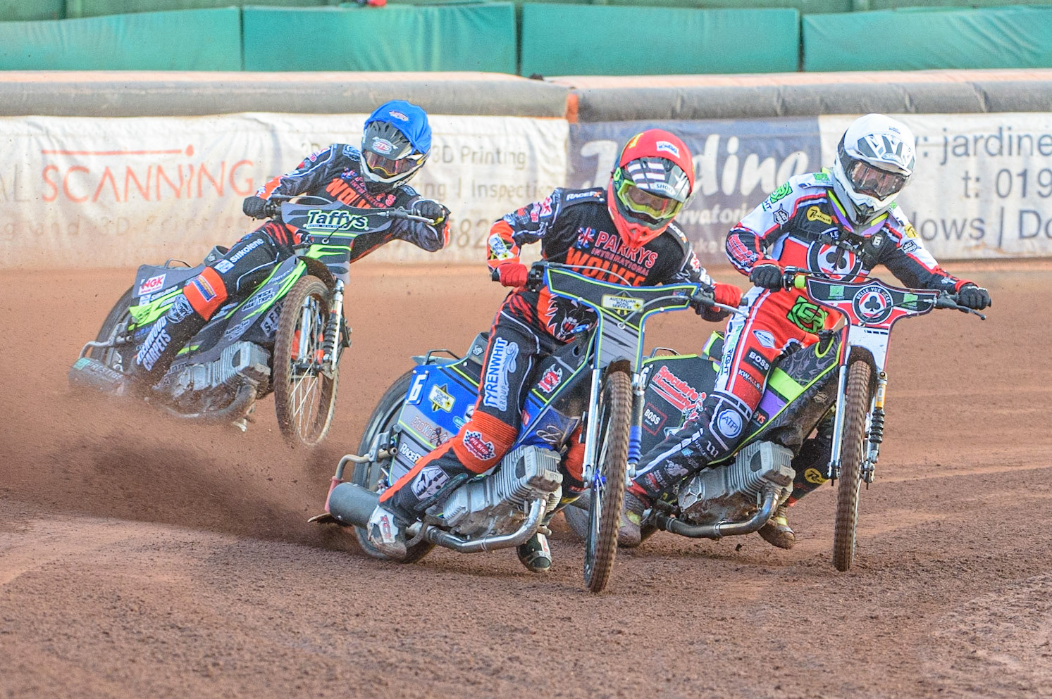 WOLVERHAMPTON, UK. JULY 26TH  Ryan Douglas   (Red) leads Tom Brennan (White) and Leon Flint  (Blue)during the SGB Premiership match between Wolverhampton Wolves and Belle Vue Aces at the Ladbroke Stadium, Wolverhampton on Monday 26th July 2021. (Credit: Ian Charles | MI News)