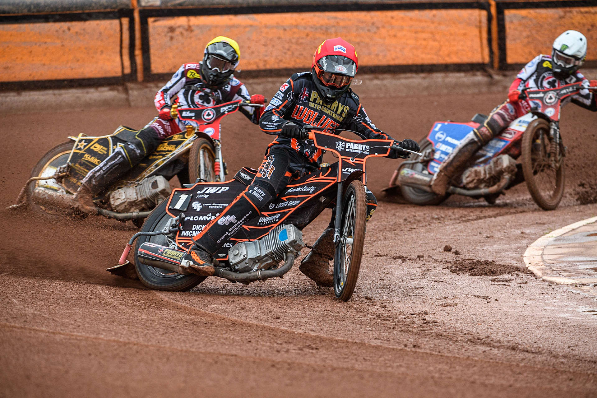 Sam Masters (Red) leads Norick Blodorn (Yellow) and Dan Bewley (White) during the Sports Insure Premiership match between Wolverhampton Wolves and Belle Vue Aces at Monmore Green Stadium, Wolverhampton on Monday 10th July 2023. (Photo: Ian Charles | MI News)