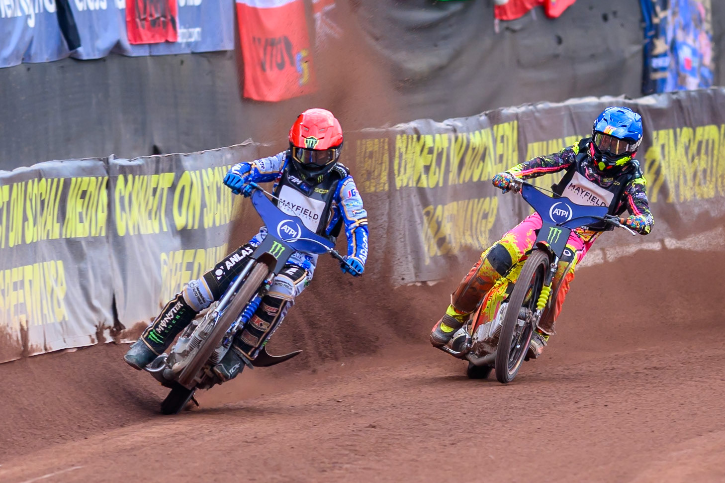 Jack Holder (25) of Australia in Red picks up some drive leading Michael Jepsen Jensen (52) of Denmark in Blue during the ATPI  FIM Speedway GP of Manchester at the National Speedway Stadium, Manchester on Saturday 6th June 2026. (Photo: Ian Charles | MI News)