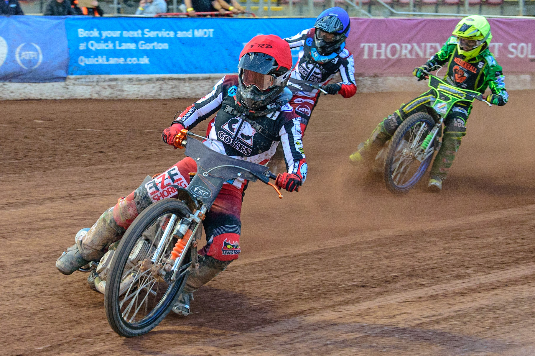 Jack Smith  (Red) leads Harry McGurk  (Blue) and Sam Bebee  (Yellow) during the National Development League match between Belle Vue Colts and Mildenhall Fens Tigers at the National Speedway Stadium, Manchester on Friday 15th July 2022. (Credit: Ian Charles | MI News)