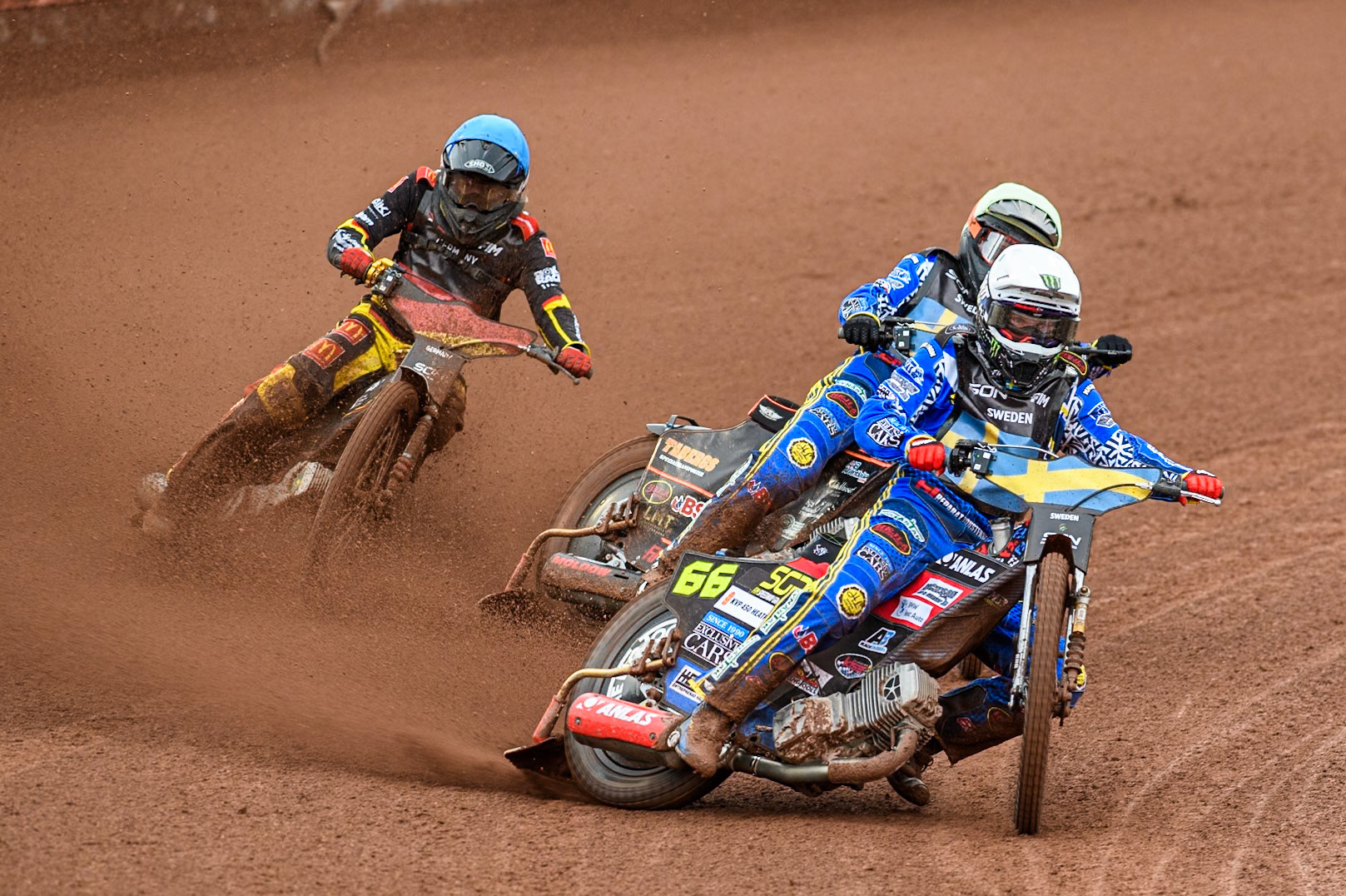 Fredrik Lindgren of Sweden in White leading Jacob Thorssell of Sweden in Yellow and Norick Blödorn of Germany in Blue during the Monster Energy FIM Speedway of Nations Semi-Final 1 at the National Speedway Stadium, Manchester on Tuesday 9th July 2024. (Photo: Ian Charles | MI News)