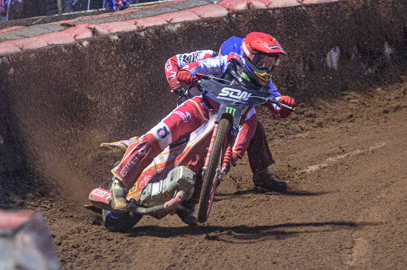 MANCHESTER, UK. OCT 17TH The moment Great Britain became champions as pl1(Red) causes team mate Maciej Janowski (Blue) to hit the dirt during the Monster Energy FIM Speedway of Nations at the National Speedway Stadium, Manchester on Sunday  17th October 2021. (Credit: Ian Charles | MI News)