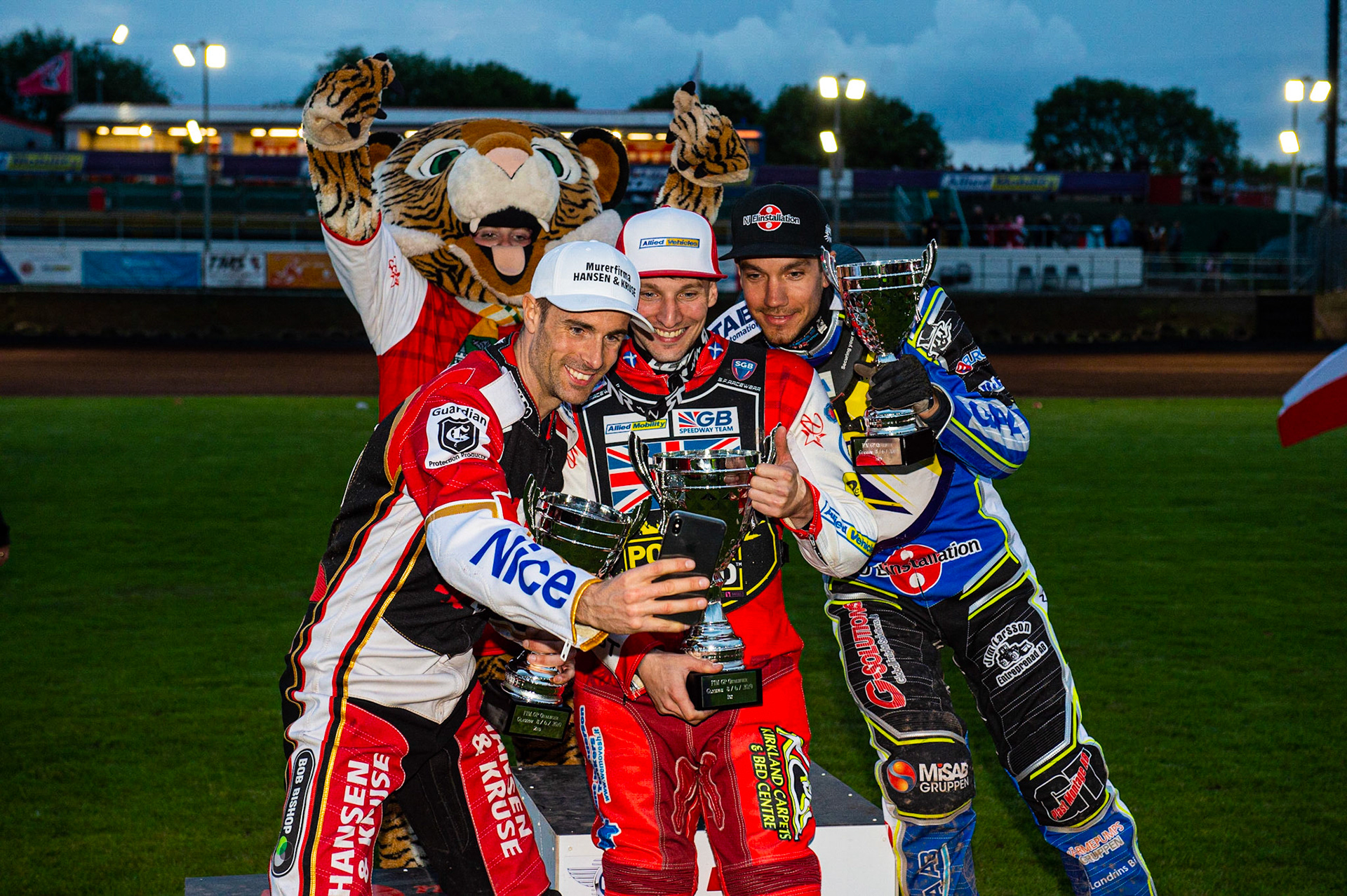 Photo by Ian Charles:

Top 3 take a selfie: Niels-Kristian Iversen (2nd), Craig Cook (1st), Pontus Aspgren (3rd) with Glasgow Mascot Roary (Rear)


FIM Speedway Grand Prix World Championship - Qualifying Round 1, Peugeot Ashfield Stadium, Glasgow, 8 June 2019