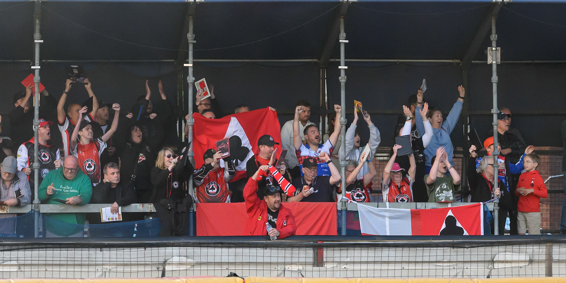 Belle Vue Aces fans celebrate the win in heat 12 during the Rowe Motor Oil Premiership match between Birmingham Brummies and Belle Vue Aces at Perry Barr Stadium, Birmingham on Monday 28th July 2025. (Photo: Ian Charles | MI News)