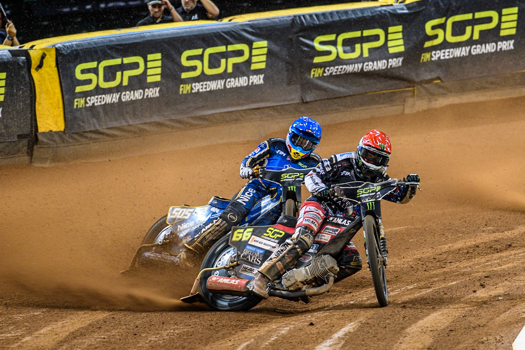 Fredrik Lindgren (66) of Sweden in Red leading Robert Lambert (505) of Great Britain in Blue  in Semi Final 1 during the FIM Speedway Grand Prix of Great Britain at The Principality Stadium, Cardiff on Saturday 17th August 2024. (Photo: Ian Charles | MI News)