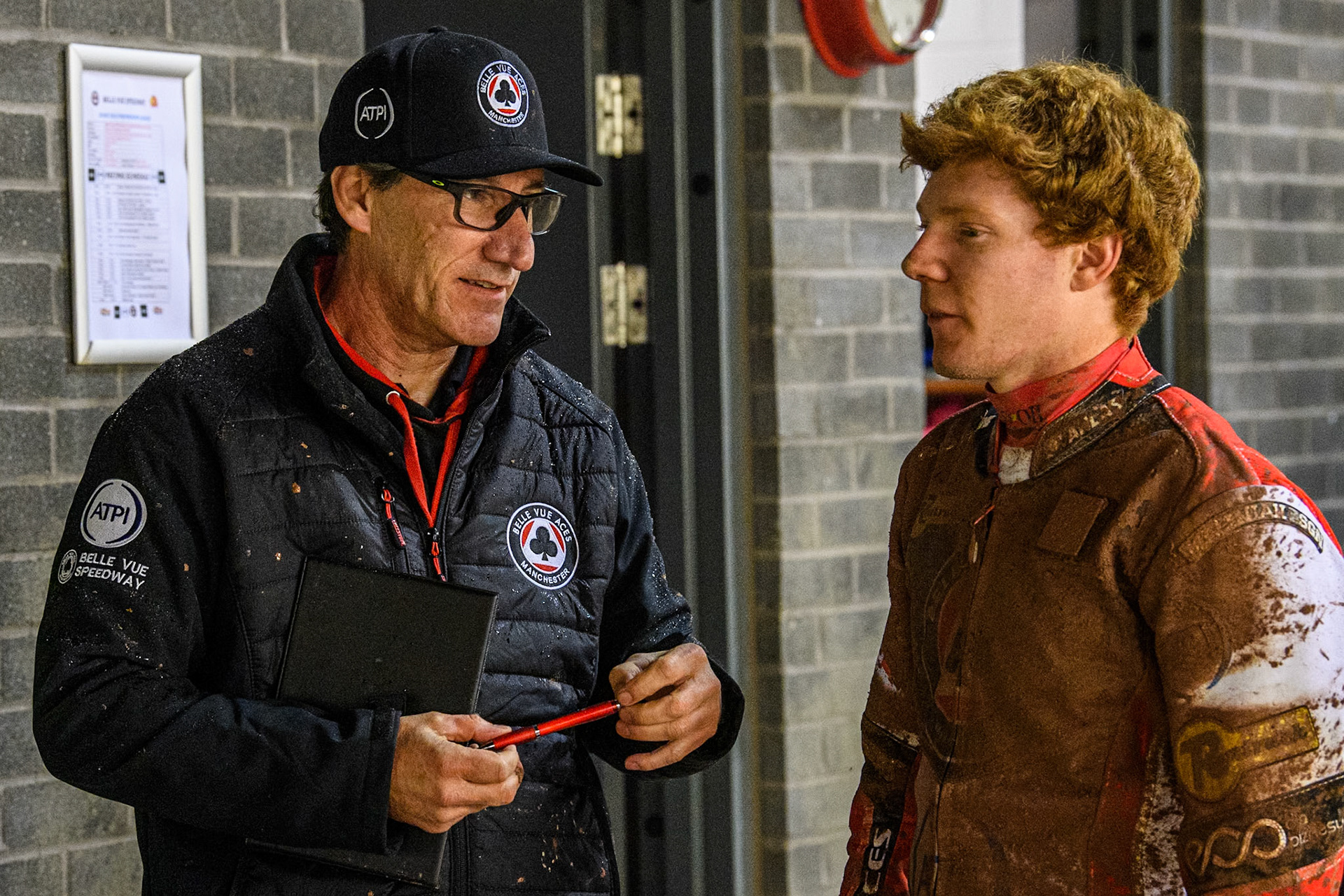 Mark Lemon, Team Manager of Belle Vue Aces (Left) chats with Dan Bewley of Belle Vue Aces during the Rowe Motor Oil Premiership match between Belle Vue Aces and Leicester Lions at the National Speedway Stadium, Manchester on Saturday 6th April 2024. (Photo: Ian Charles | MI News)