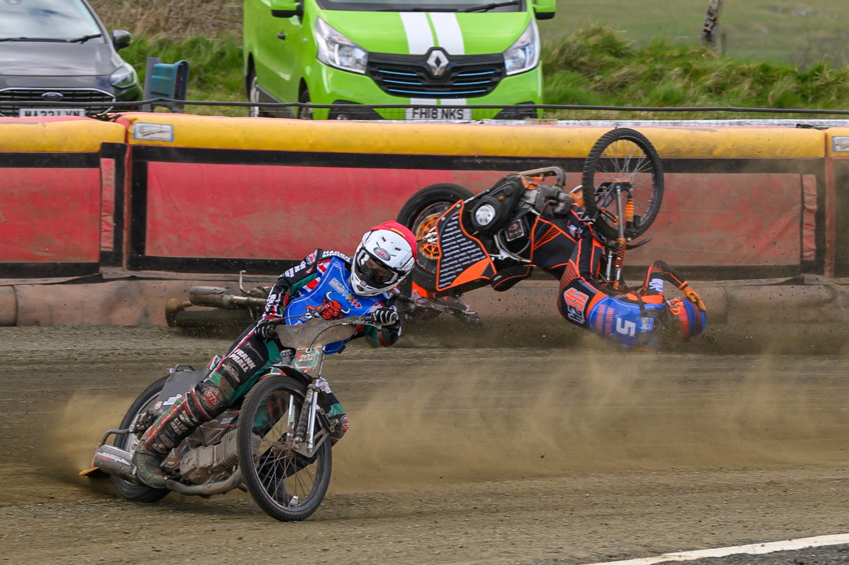 Connor Coles of NDL Nomads   in White fall and Jack Smith of Buxton Bulls   in Blue collides with him during the  Challenge match between Buxton Bulls and NDL Nomads at Hi-Edge Speedway, Buxton on Sunday 19th April 2026. (Photo: Ian Charles | MI News)