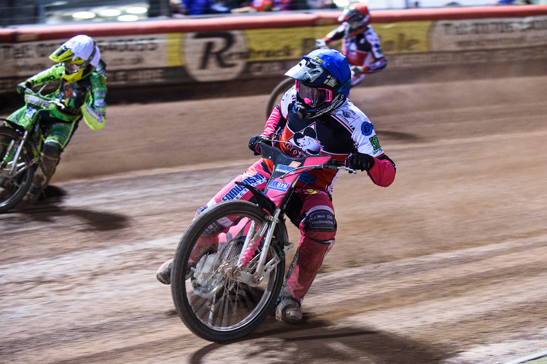 MANCHESTER, SEPT 3RD. Sam Woolley  (Blue) inside Sam Bebee  (White) with Jack Parkinson-Blackburn  (Red) behind during the National Development League match between Belle Vue Aces and Mildenhall Fens Tigers at the National Speedway Stadium, Manchester on Friday 3rd September 2021. (Credit: Ian Charles | MI News)