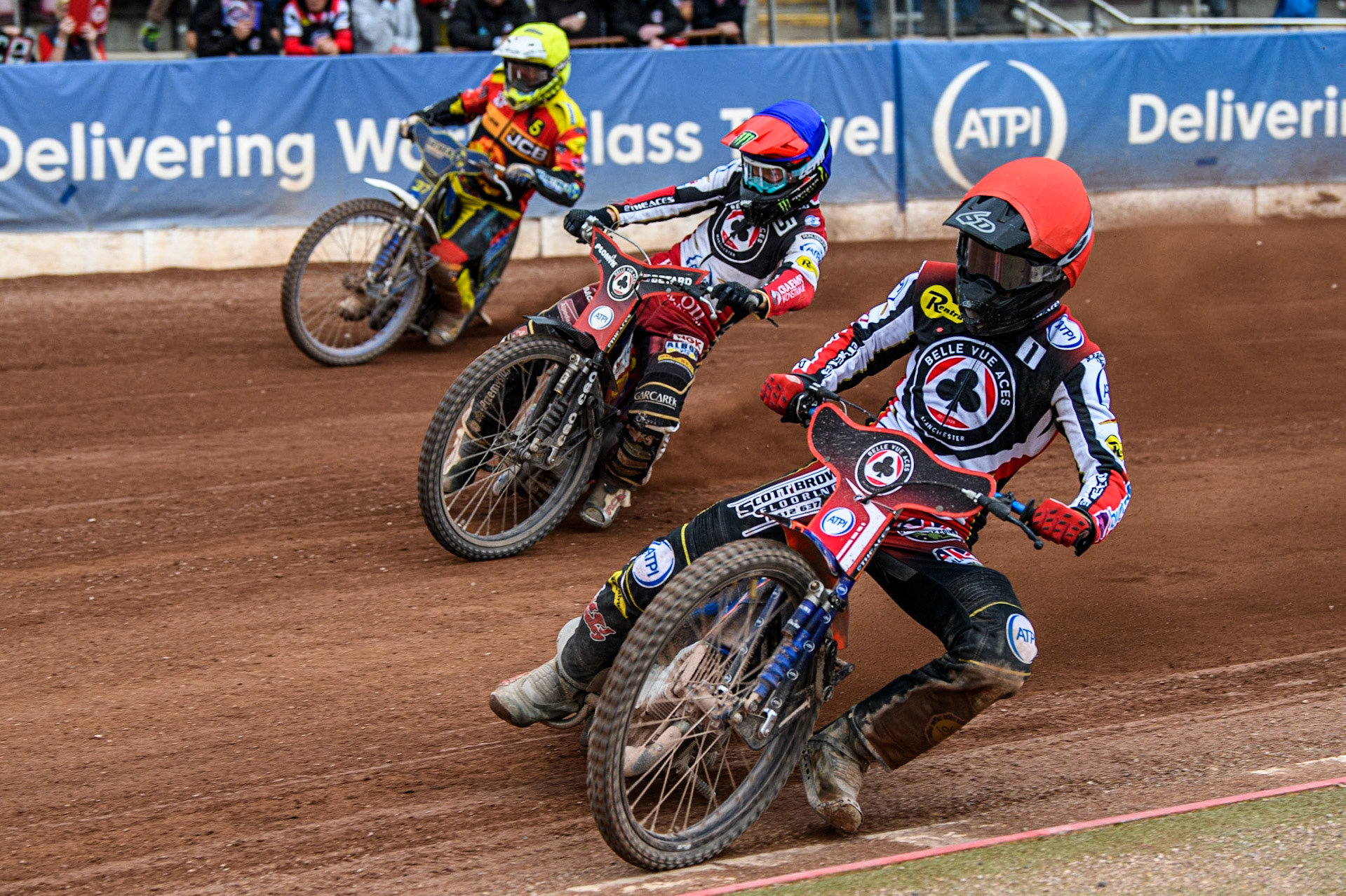 Brady Kurtz (Red) inside team mate Dan Bewley (Blue) and Chris Harris (Yellow) during the Sports Insure Premiership match between Belle Vue Aces and Leicester Lions at the National Speedway Stadium, Manchester on Monday 28th August 2023. (Photo: Ian Charles | MI News)