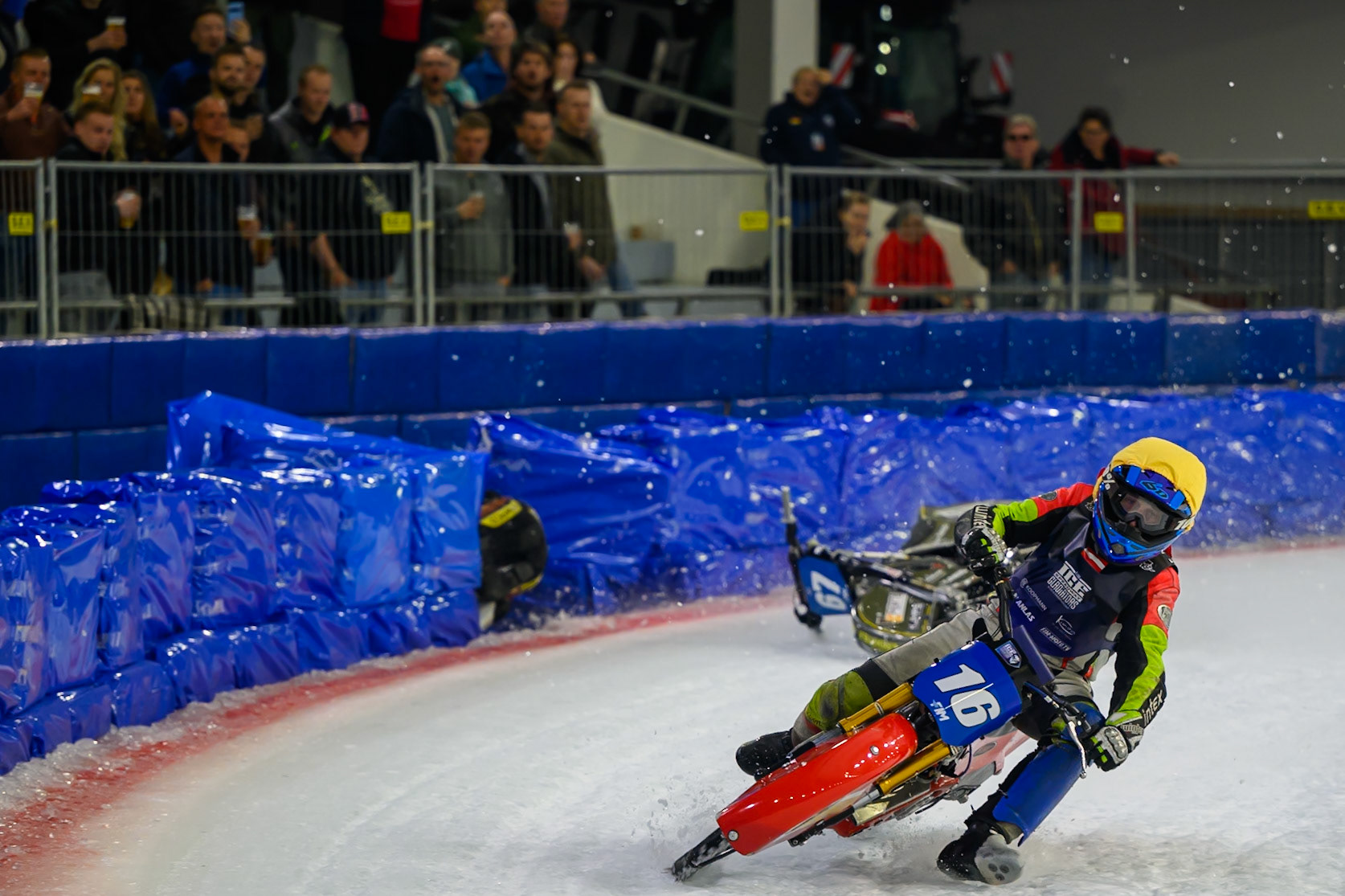 Heikki Huusko (67) of Finland  collides with Wild Card Harald Simon (16) of Austria in Yellow in the first turn during the FIM Ice Speedway Gladiators World Championship Final 3 at Ice Rink Thialf, Heerenveen on Saturday 11th April 2026. (Photo: Ian Charles | MI News)
