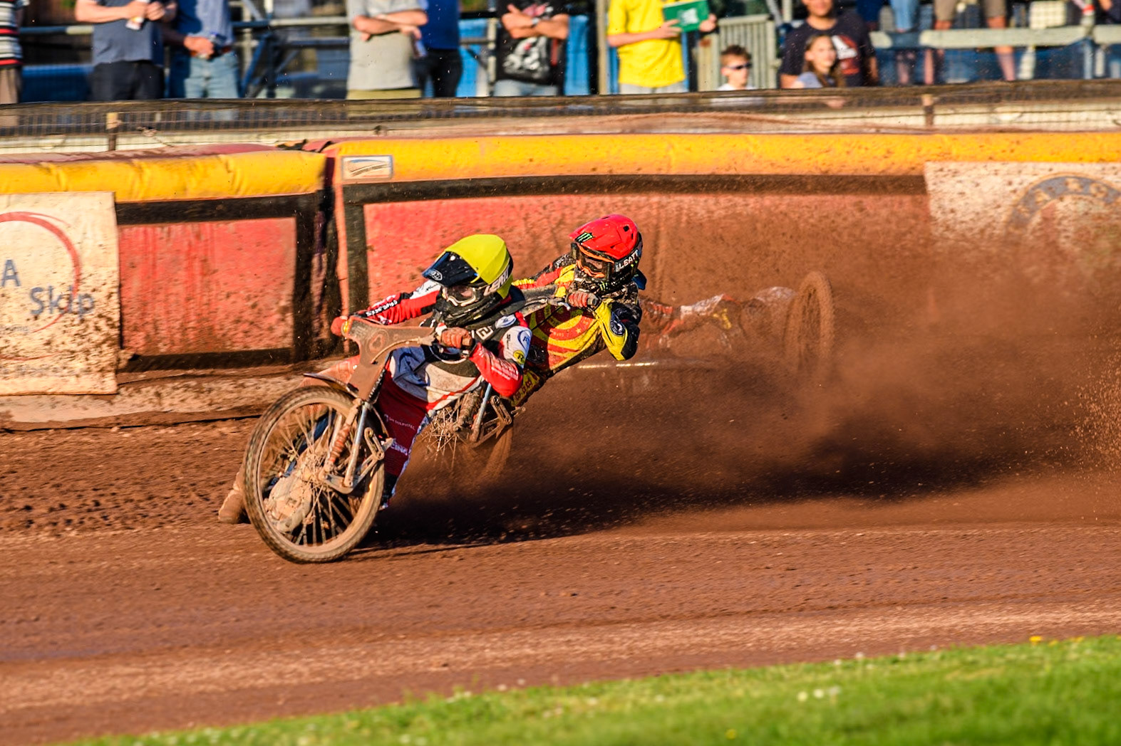 Belle Vue Aces' Brady Kurtz falls again in the rerun of Heat 1 on the first turn behind Belle Vue Aces' Norick Blodorn in Yellow and Birmingham Brummies' Freddie Lindgren in Red during the Rowe Motor Oil Premiership match between Birmingham Brummies and Belle Vue Aces at Perry Bar Stadium, Birmingham on Monday 29th July 2024. (Photo: Ian Charles | MI News)
