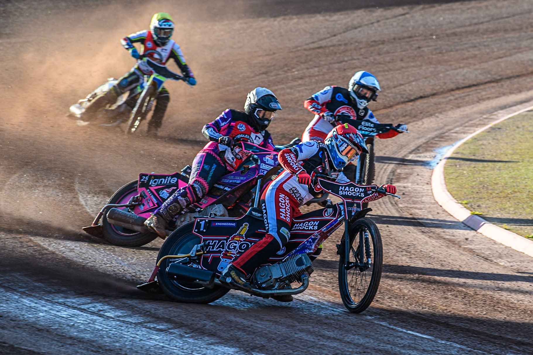 Belle Vue Colts' Sam Hagon in Red leading Middlesbrough Tigers' Ben Trigger in White, Belle Vue Colts' Chad Wirtzfeld in Blue and Middlesbrough Tigers' Ben Rathbone in Yellow during the WSRA National Development League match between Belle Vue Colts and Middlesbrough Tigers at the National Speedway Stadium, Manchester on Monday 17th June 2024. (Photo: Ian Charles | MI News)