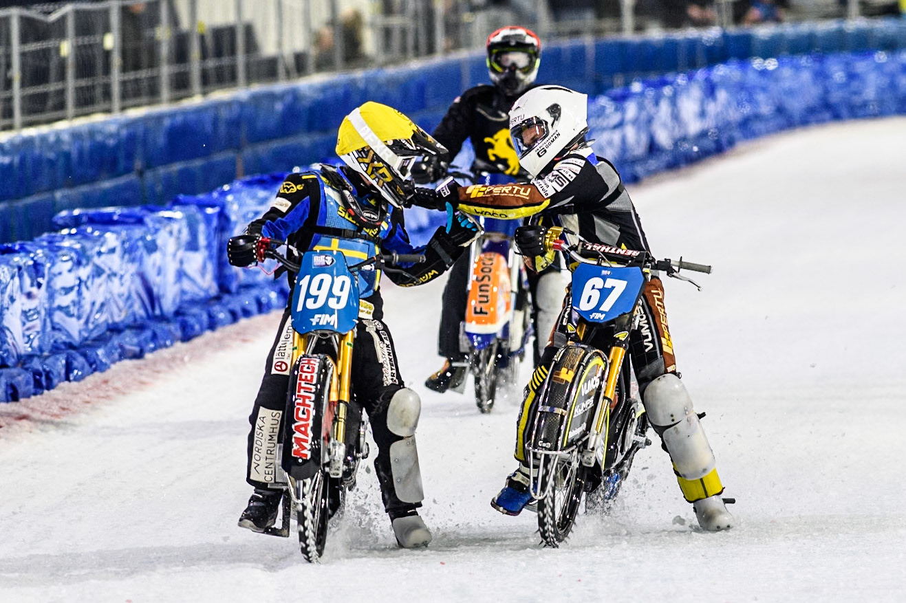 Heikki Huusko (67) of Finland in White congratulates Martin Haarahiltunen (199) of Sweden on his heat 14 win during the FIM Ice Speedway Gladiators World Championship, Final 4 at the Ice Stadium, Thialf, Heerenveen on Sunday 6th April 2025. (Photo: Ian Charles | MI News)