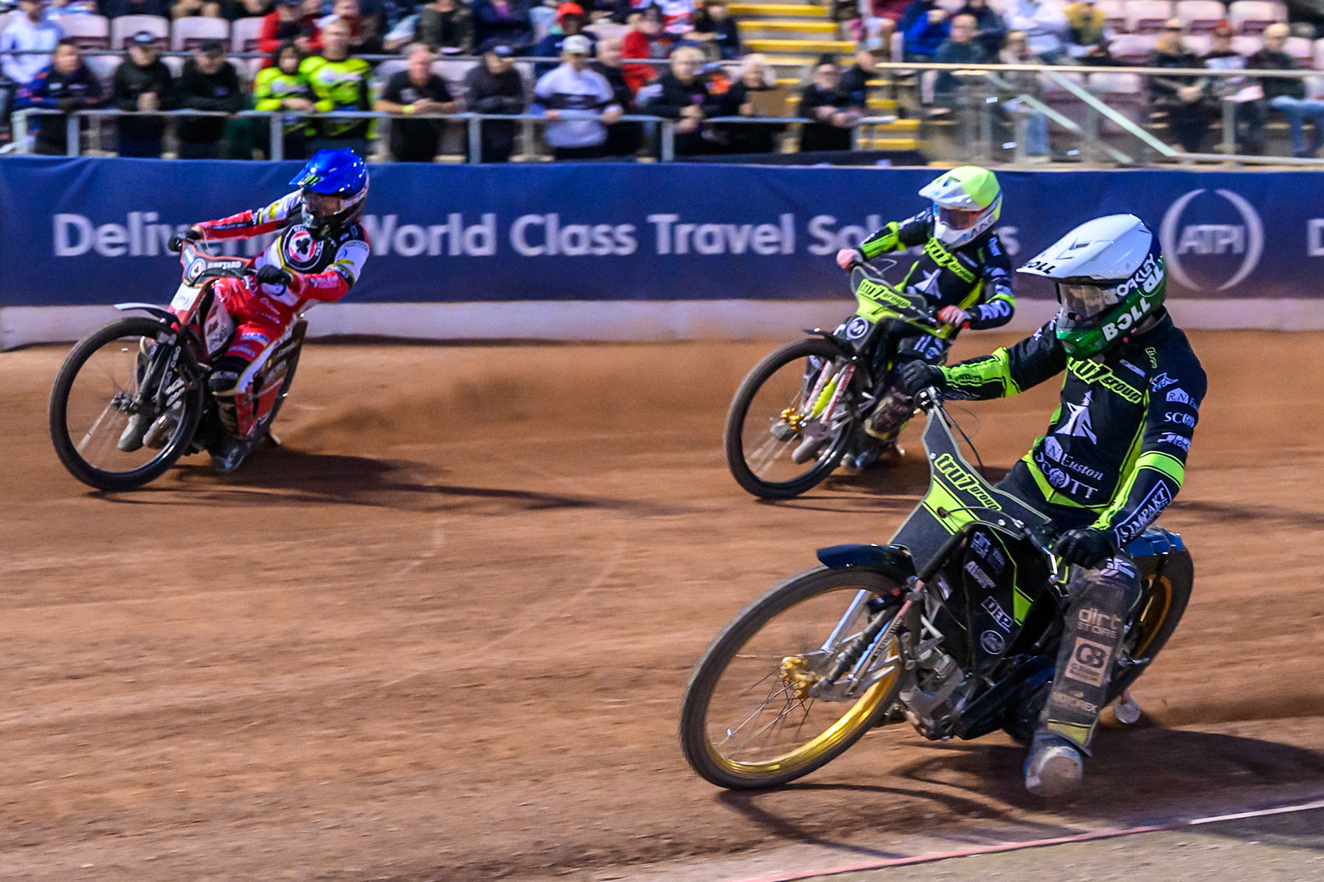Jason Doyle of Ipswich Witches  in White rides inside Dan Bewley of Belle Vue Aces  in Blue with Emil Sayfutdinov of Ipswich Witches  in Yellow behind during the Rowe Motor Oil Premiership match between Belle Vue Aces and Ipswich Witches at the National Speedway Stadium, Manchester on Monday 4th August 2025. (Photo: Ian Charles | MI News)