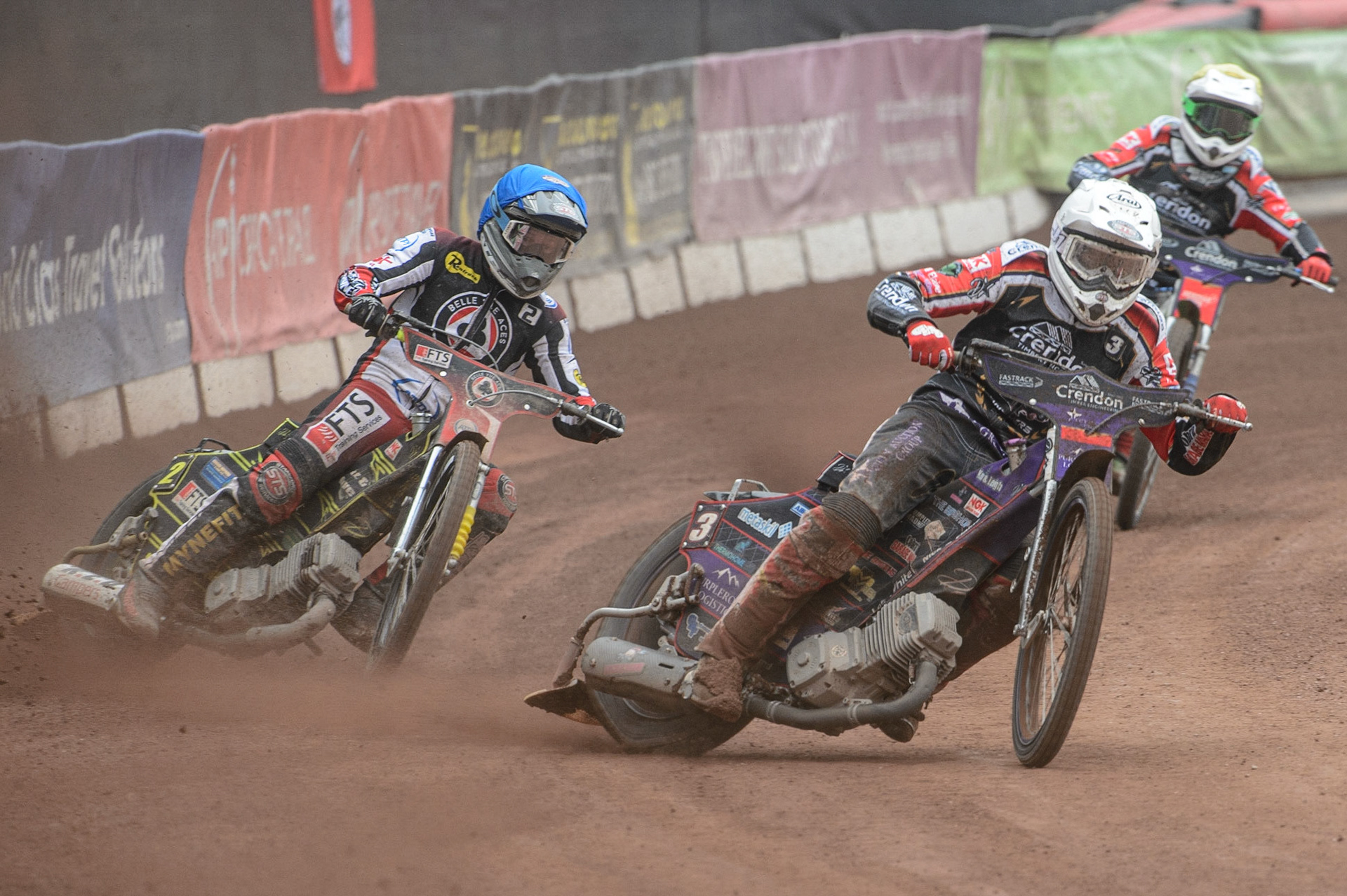 MANCHESTER, UK. MAY 2ND Ulrich Ostergaard  (White) passes Jye Etheridge   (Blue) with Hans Andersen   (Yellow) behind  during the SGB Premiership match between Belle Vue Aces and Peterborough at the National Speedway Stadium, Manchester on Monday 2nd May 2022. (Credit: Ian Charles | MI News)