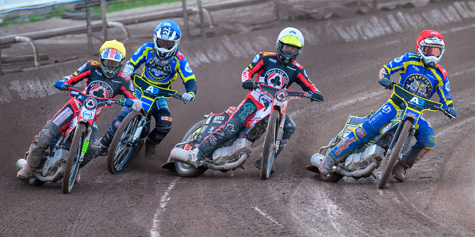 (L to R) Will Cairns of Belle Vue Aces in Yellow, Freddie Hodder, Guest Rider for Sheffield Tigers in Blue, Tate Zischke of Belle Vue Aces in White and Jye Etheridge of Sheffield Tigers in Red go into the first turn  during the Rowe Motor Oil Premiership match between Sheffield Tigers and Belle Vue Aces at Owlerton Stadium, Sheffield on Monday 25th May 2026. (Photo: Ian Charles | MI News)