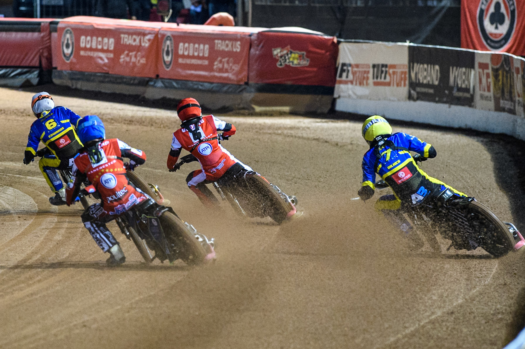 Sheffield Tigers' Dan Gilkes  in Yellow chases Belle Vue Aces' Jake Mulford  in Blue, Belle Vue Aces' Antti Vuolas  in Red and Sheffield Tigers' Jason Edwards  in White during the Rowe Motor Oil Premiership Play Off Semi Final 2, 1st Leg match between Belle Vue Aces and Sheffield Tigers at the National Speedway Stadium, Manchester on Monday 16th September 2024. (Photo: Ian Charles | MI News)
