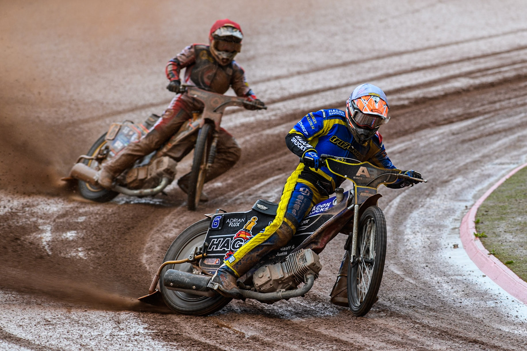 Sheffield Tigers' Jason Edwards in White leading Belle Vue Aces' Connor Mountain in Red during the Rowe Motor Oil Premiership match between Belle Vue Aces and Sheffield Tigers at the National Speedway Stadium, Manchester on Monday 27th May 2024. (Photo: Ian Charles | MI News)