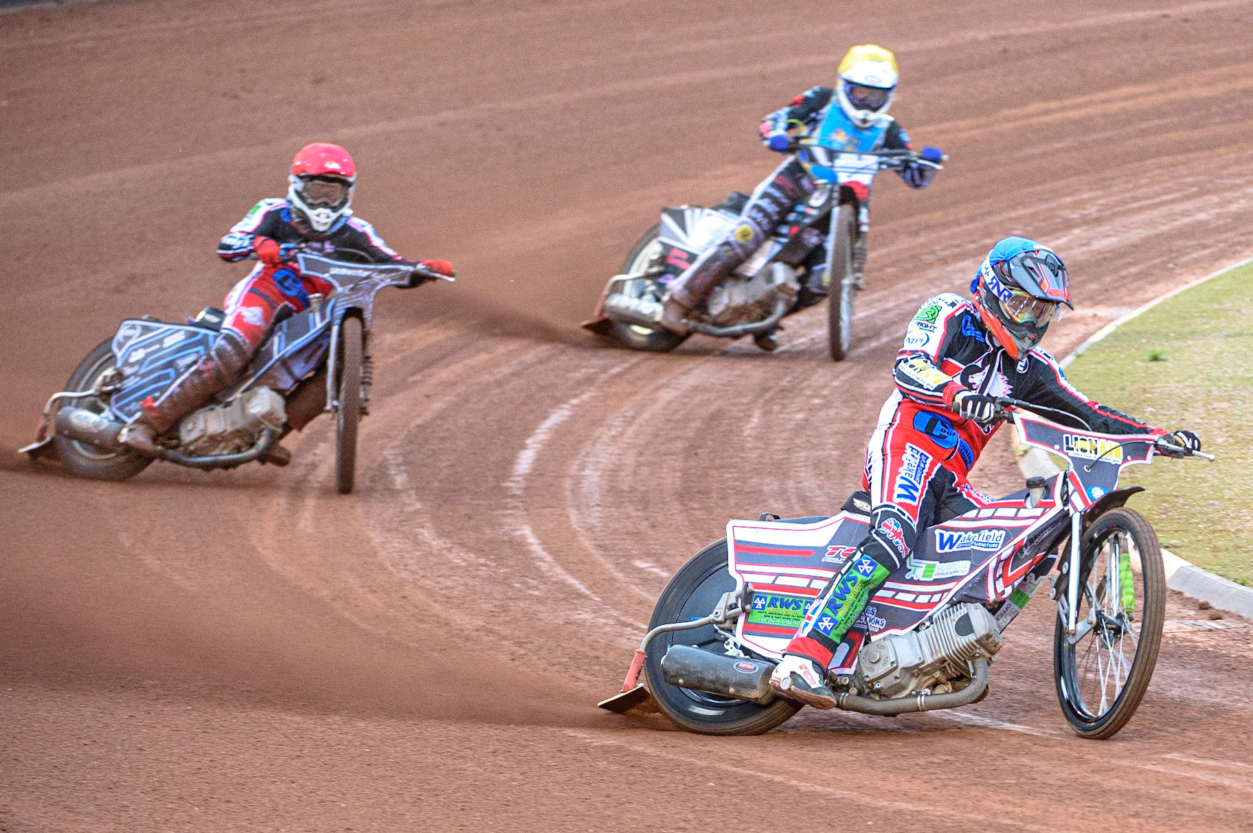 MANCHESTER, UK. AUGUST 20TH Jack Parkinson-Blackburn  (Blue) leads Sam McGurk  (Red) and Archie Freeman  (Yellow) during the National Development League match between Belle Vue Aces and Armadale Devils at the National Speedway Stadium, Manchester on Friday 20th August 2021. (Credit: Ian Charles | MI News)