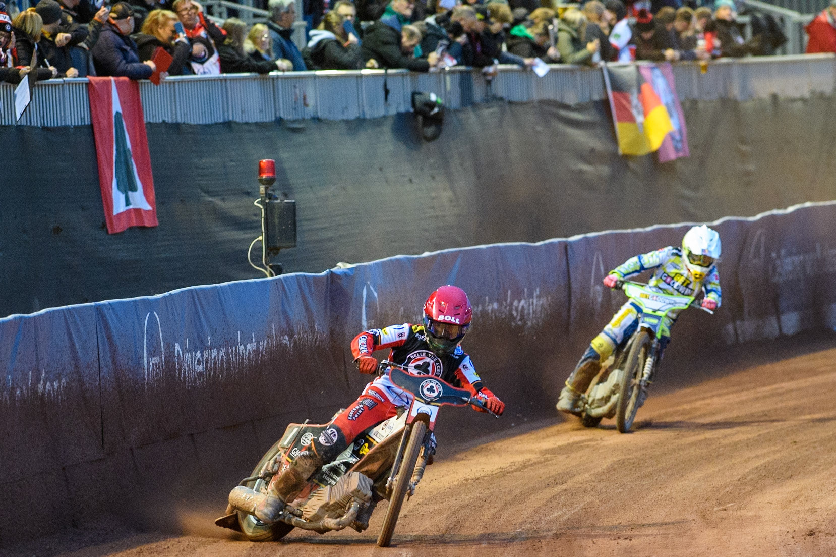 Belle Vue Aces' Brady Kurtz in Red leading Oxford Spires' Maciej Janowski in White during the Rowe Motor Oil Premiership match between Belle Vue Aces and Oxford Spires at the National Speedway Stadium, Manchester on Monday 14th April 2025. (Photo: Ian Charles | MI News)