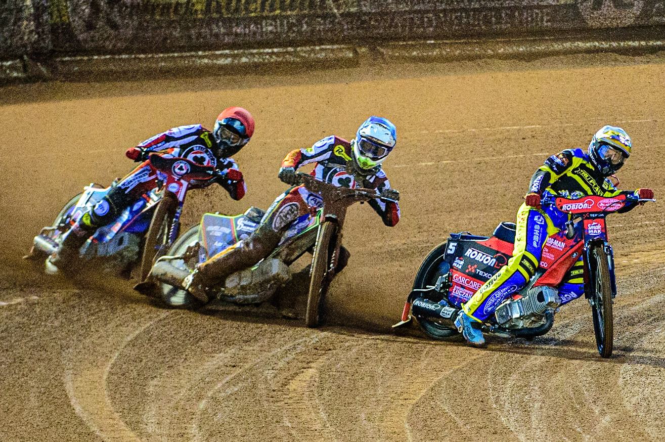 Tobiasz Musielak  (White) inside Jake Mulford  (Blue) and Brady Kurtz  (Red) during the SGB Premiership match between Belle Vue Aces and Sheffield Tigers at the National Speedway Stadium, Manchester on Monday 27th March 2023. (Photo: Ian Charles | MI News)