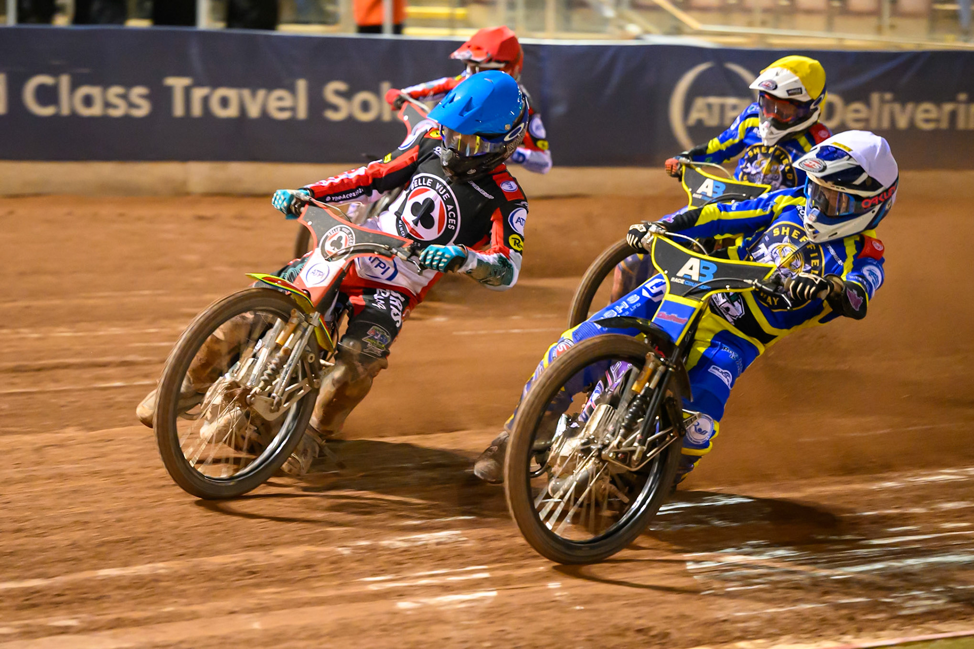 Leon Flint of Sheffield Tigers    in White rides inside Tate Zischke of Belle Vue Aces   in Blue with Zach Cook of Belle Vue Aces   in Red and Luke Killeen of Sheffield Tigers  in Yellow behind during the Knockout Cup, Northern Section match between Belle Vue Aces and Sheffield Tigers at the National Speedway Stadium, Manchester on Monday 30th March 2026. (Photo: Ian Charles | MI News)