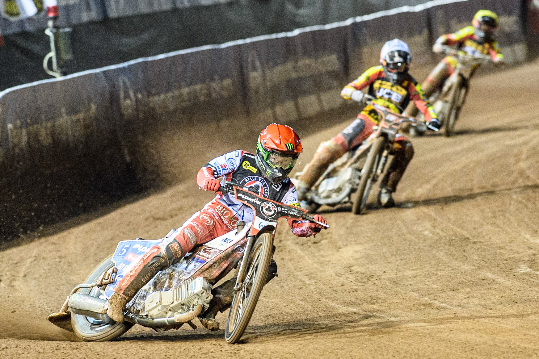 Belle Vue Aces' Dan Bewley  in Red leading Leicester Lions' Sam Masters  in White and Leicester Lions' Luke Becker  in Yellow during the Rowe Motor Oil Premiership Grand Final 1st Leg between Belle Vue Aces and Leicester Lions at the National Speedway Stadium, Manchester on Monday 23rd September 2024. (Photo: Ian Charles | MI News)