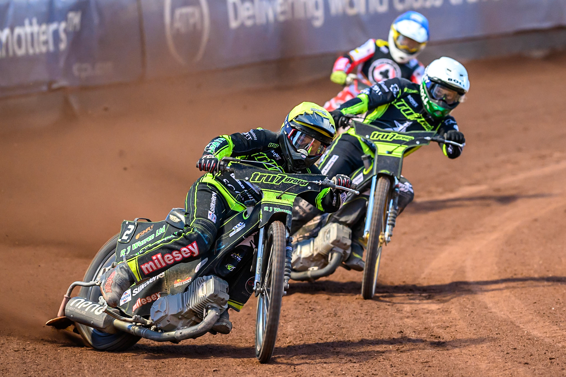 Danny King of Ipswich Witches  in Yellow leading Jason Doyle of Ipswich Witches  in White and Jake Mulford of Belle Vue Aces  in Blue during the Rowe Motor Oil Premiership match between Belle Vue Aces and Ipswich Witches at the National Speedway Stadium, Manchester on Monday 4th August 2025. (Photo: Ian Charles | MI News)