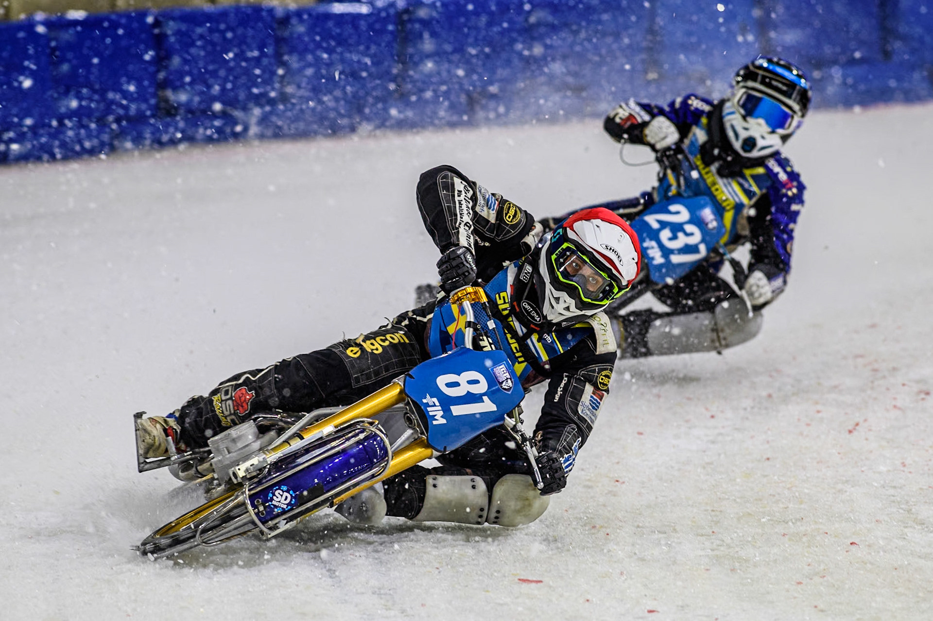 Sweden"s Jimmy Olsén (81) in Red leading Sweden's Jimmy Hörnell Lidfalk (237) in Blue during the FIM Ice Speedway Gladiators World Championship Final 3 at Ice Rink Thialf, Heerenveen on Saturday 6th April 2024. (Photo: Ian Charles | MI News)