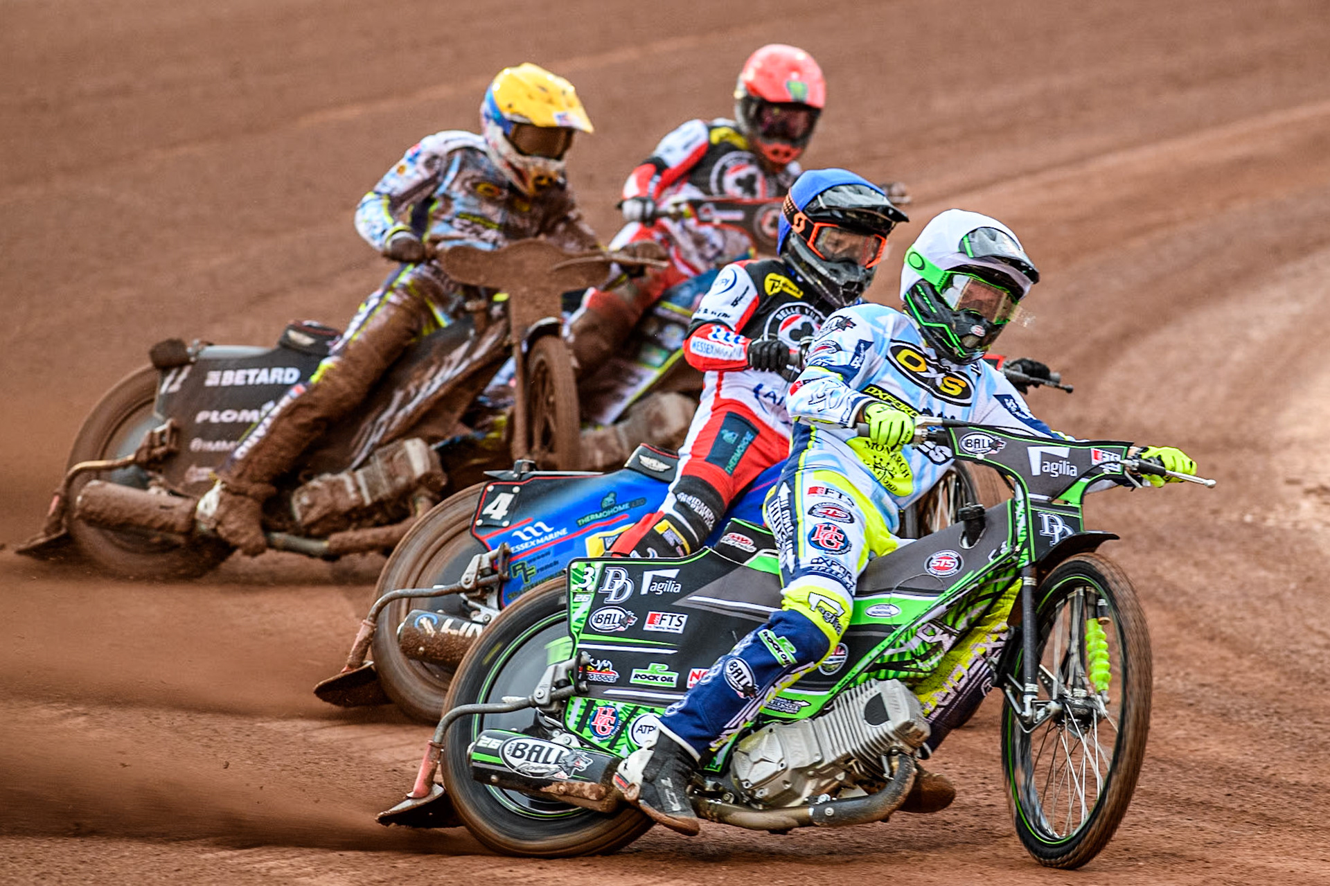 Oxford Spires' Charles Wright in White leading Belle Vue Aces' Ben Cook in Blue Oxford Spires' Maciej Janowski in Yellow and Belle Vue Aces' Jaimon Lidsey in Red during the Rowe Motor Oil Premiership match between Belle Vue Aces and Oxford Spires at the National Speedway Stadium, Manchester on Monday 13th May 2024. (Photo: Ian Charles | MI News)